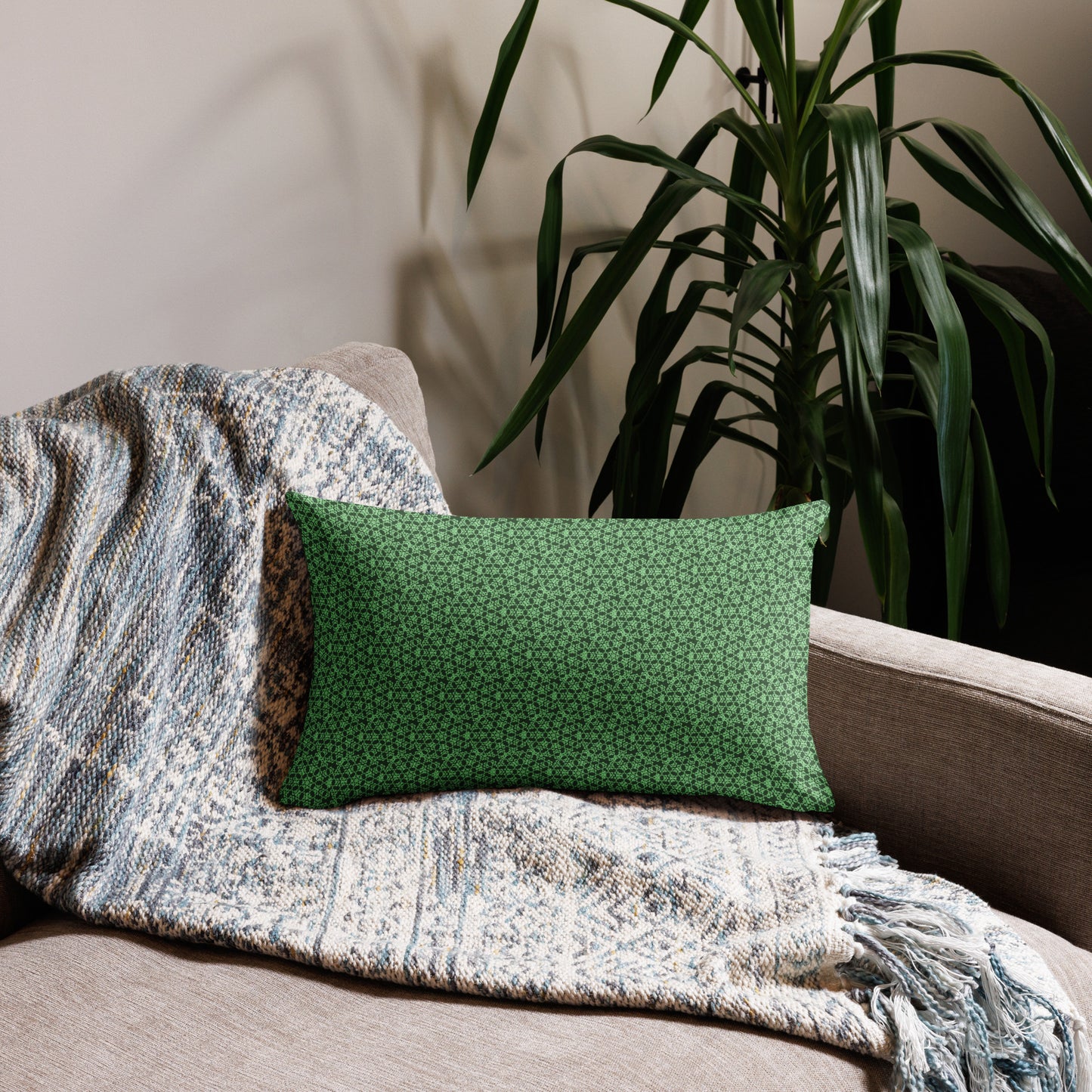 20″×12″ premium throw pillow with the 'Heptagon' green geometric pattern on a couch.