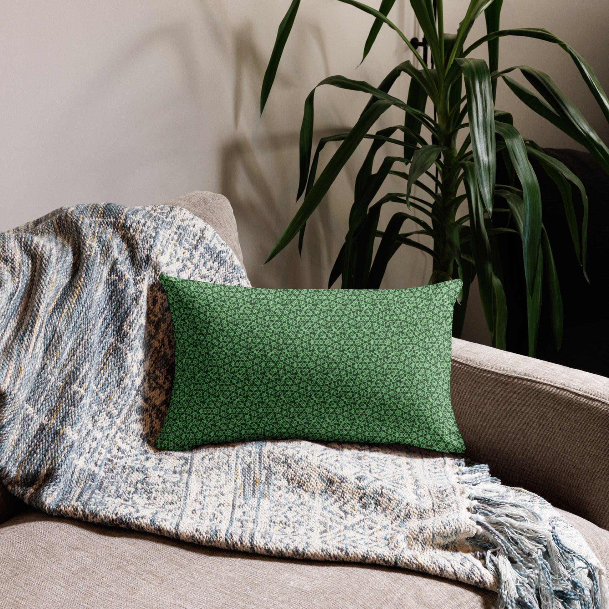 20″×12″ premium throw pillow with the 'Heptagon' green geometric pattern on a couch.