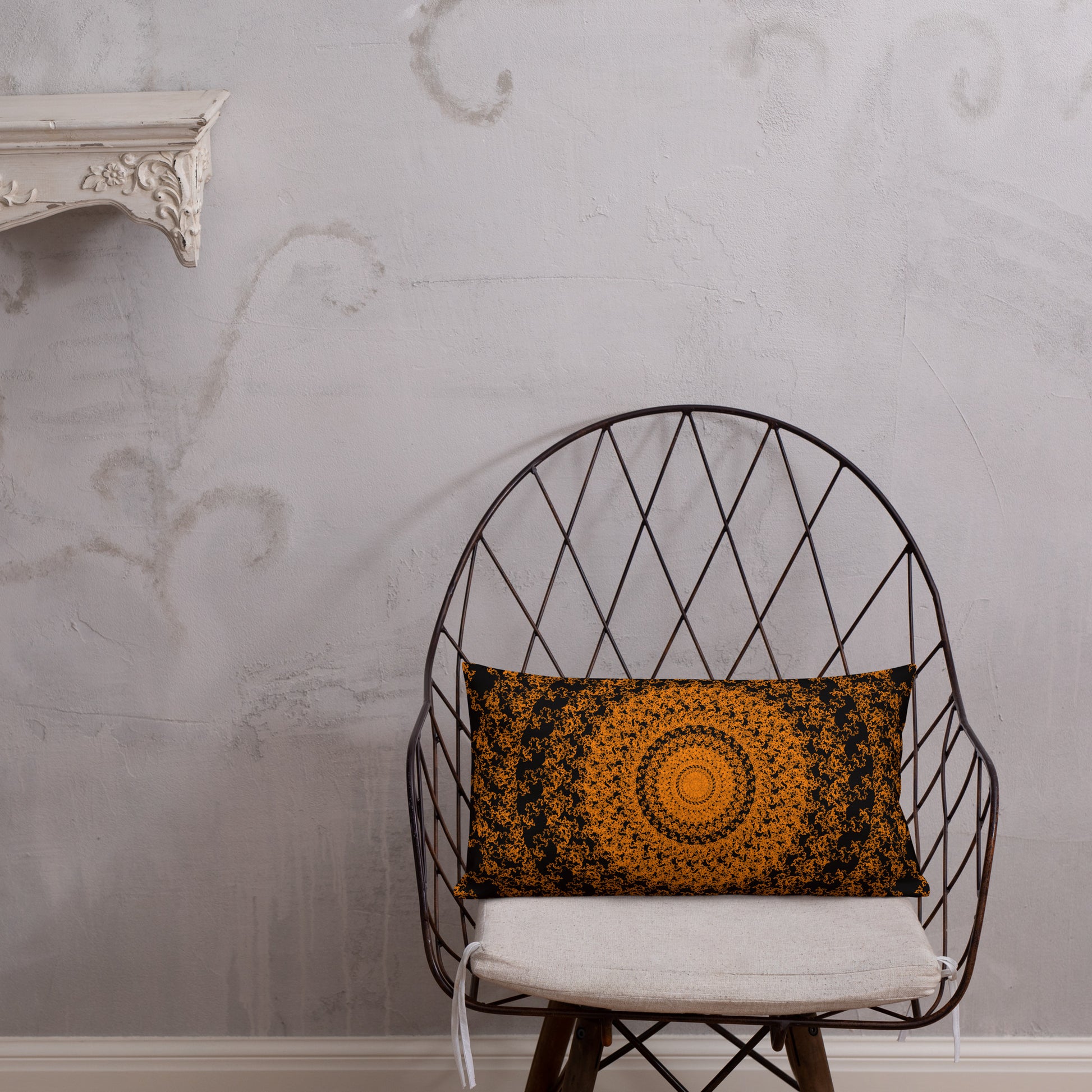 20″×12″ premium throw pillow with the 'The Sun' orange and black geometric design shown in a lifestyle setting.