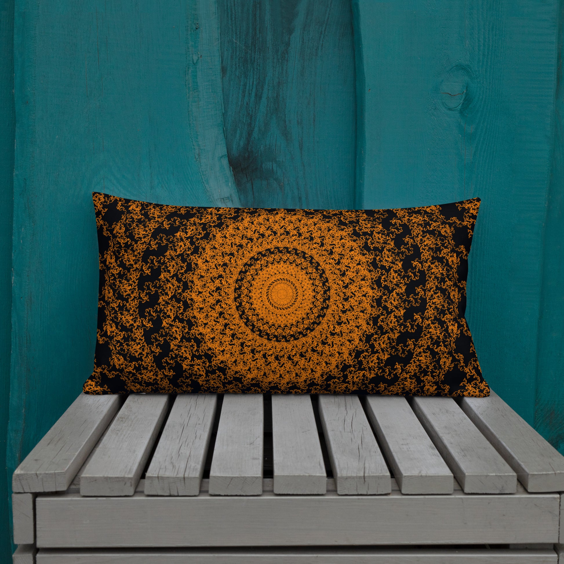 20″×12″ premium throw pillow with the 'The Sun' orange and black geometric design shown in a lifestyle setting.