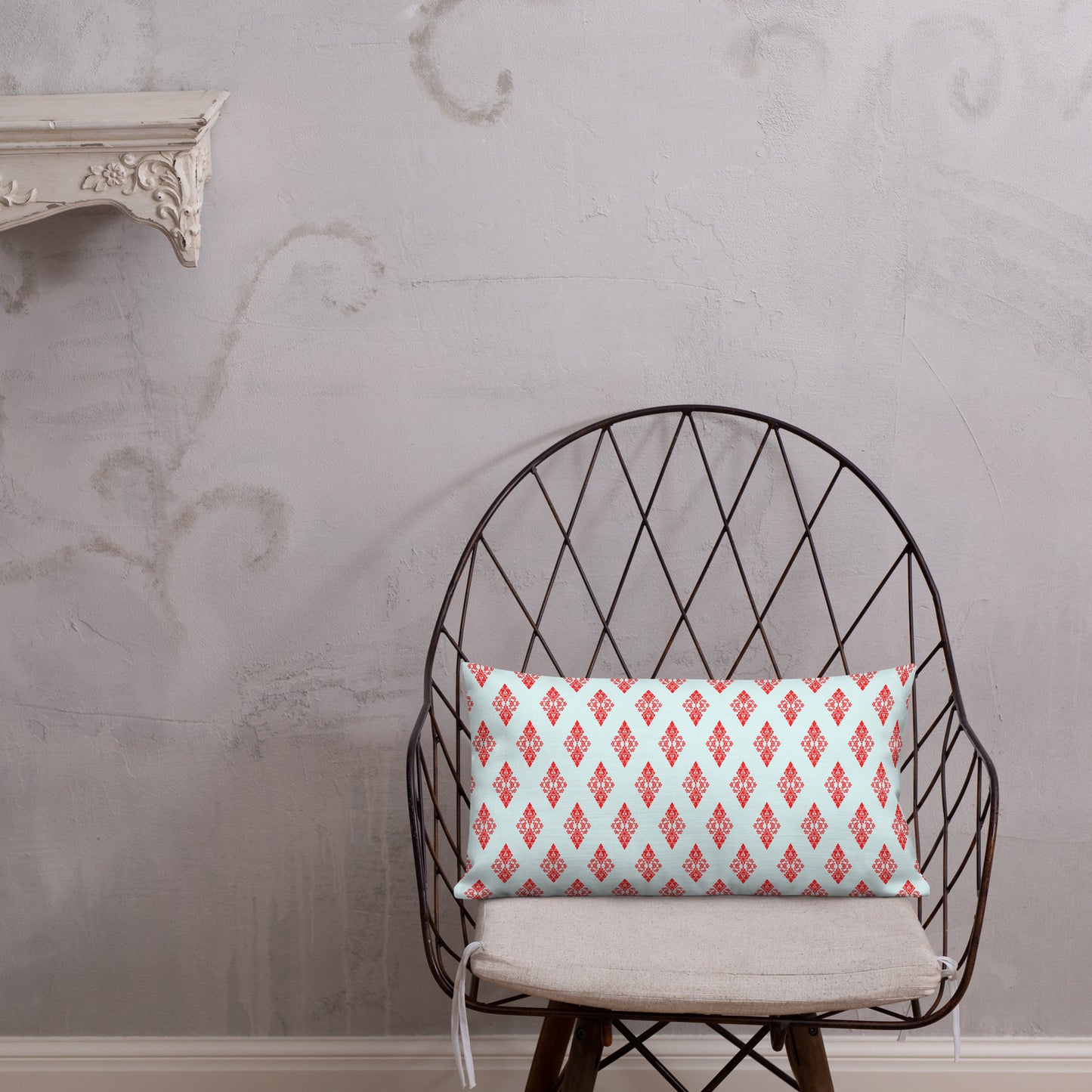 20″×12″ premium throw pillow with the 'Digon' sky blue and red geometric pattern shown in a lifestyle setting.
