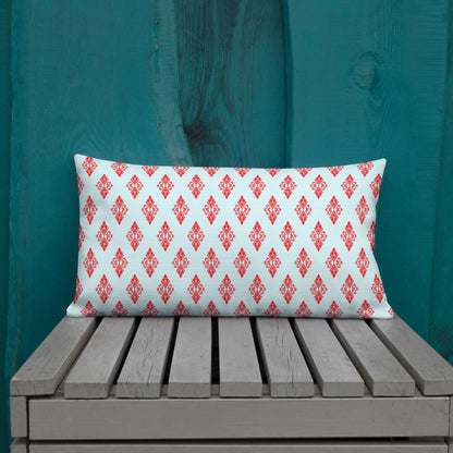 20″×12″ premium throw pillow with the 'Digon' sky blue and red geometric pattern shown in a lifestyle setting.