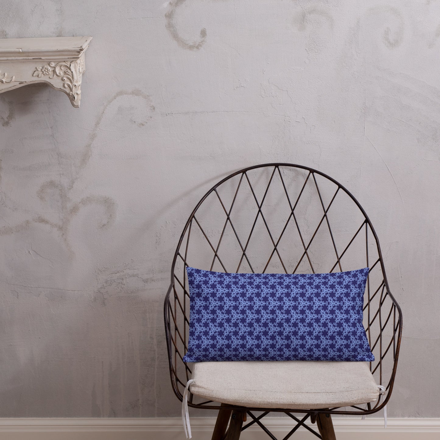20″×12″ premium throw pillow with the 'Trigon' navy and blue geometric pattern shown in a lifestyle setting.