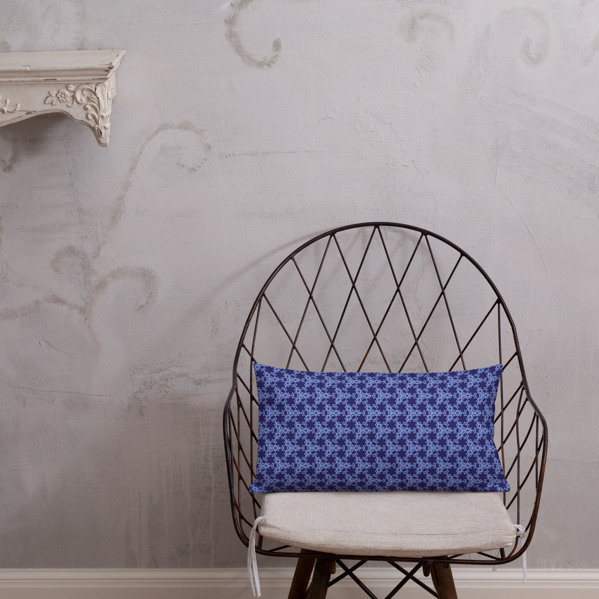20″×12″ premium throw pillow with the 'Trigon' navy and blue geometric pattern shown in a lifestyle setting.