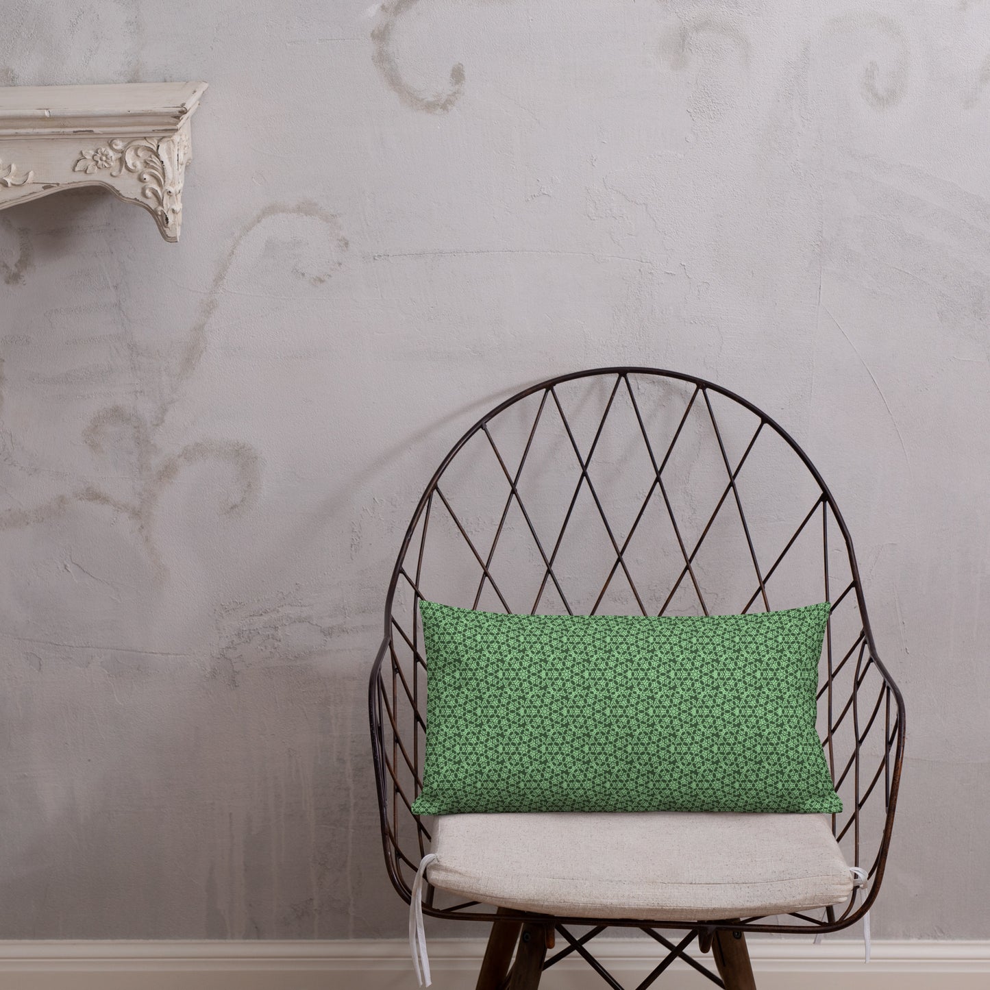 20″×12″ premium throw pillow with the 'Heptagon' green geometric pattern shown in a lifestyle setting.
