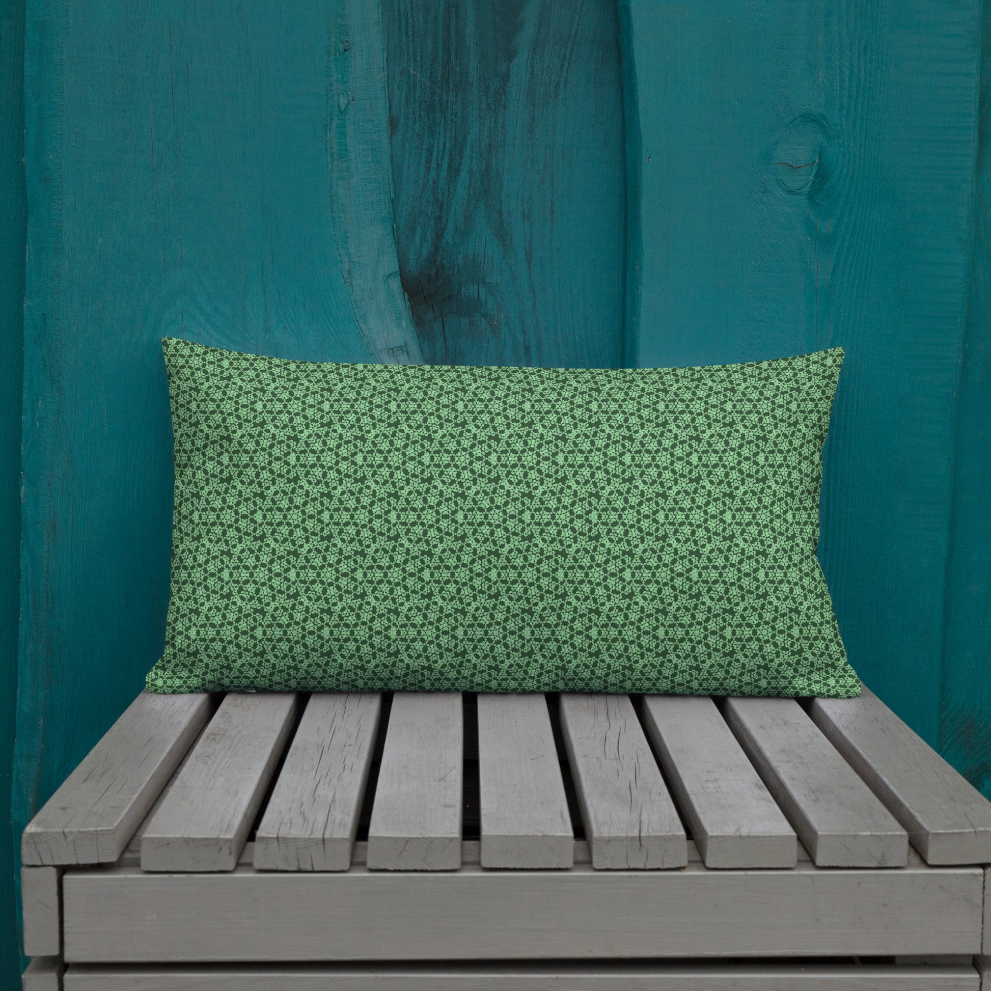 20″×12″ premium throw pillow with the 'Heptagon' green geometric pattern shown in a lifestyle setting.