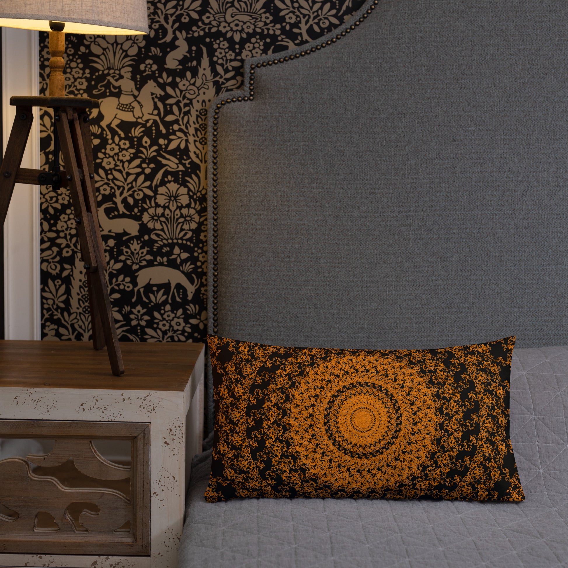 20″×12″ premium throw pillow with the 'The Sun' orange and black geometric design shown in a lifestyle setting.