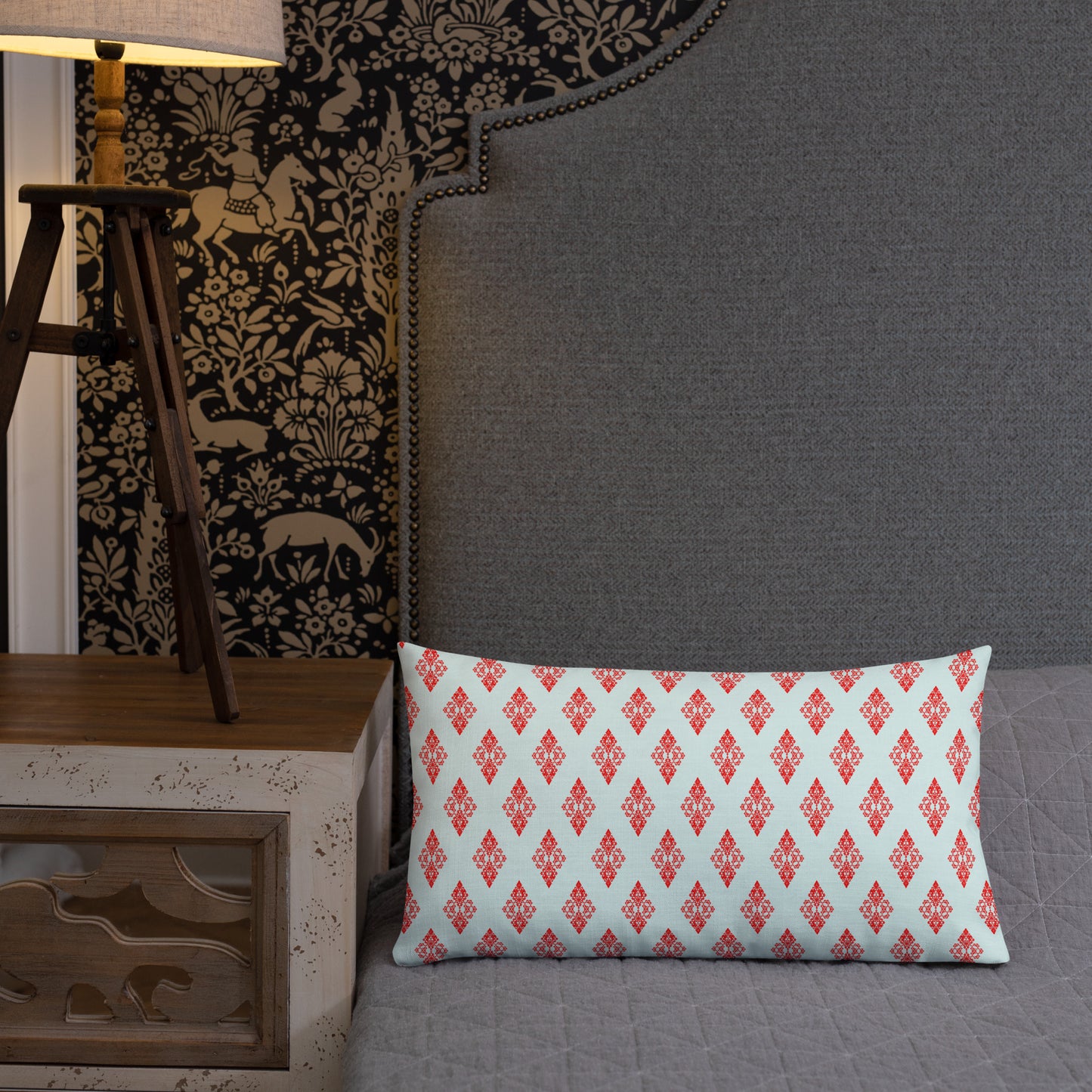 20″×12″ premium throw pillow with the 'Digon' sky blue and red geometric pattern shown in a lifestyle setting.