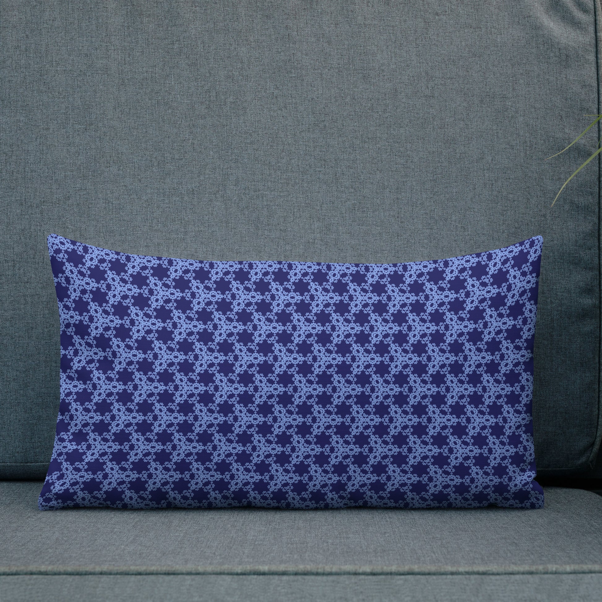 20″×12″ premium throw pillow with the 'Triagon' navy and blue geometric pattern shown in a lifestyle setting.