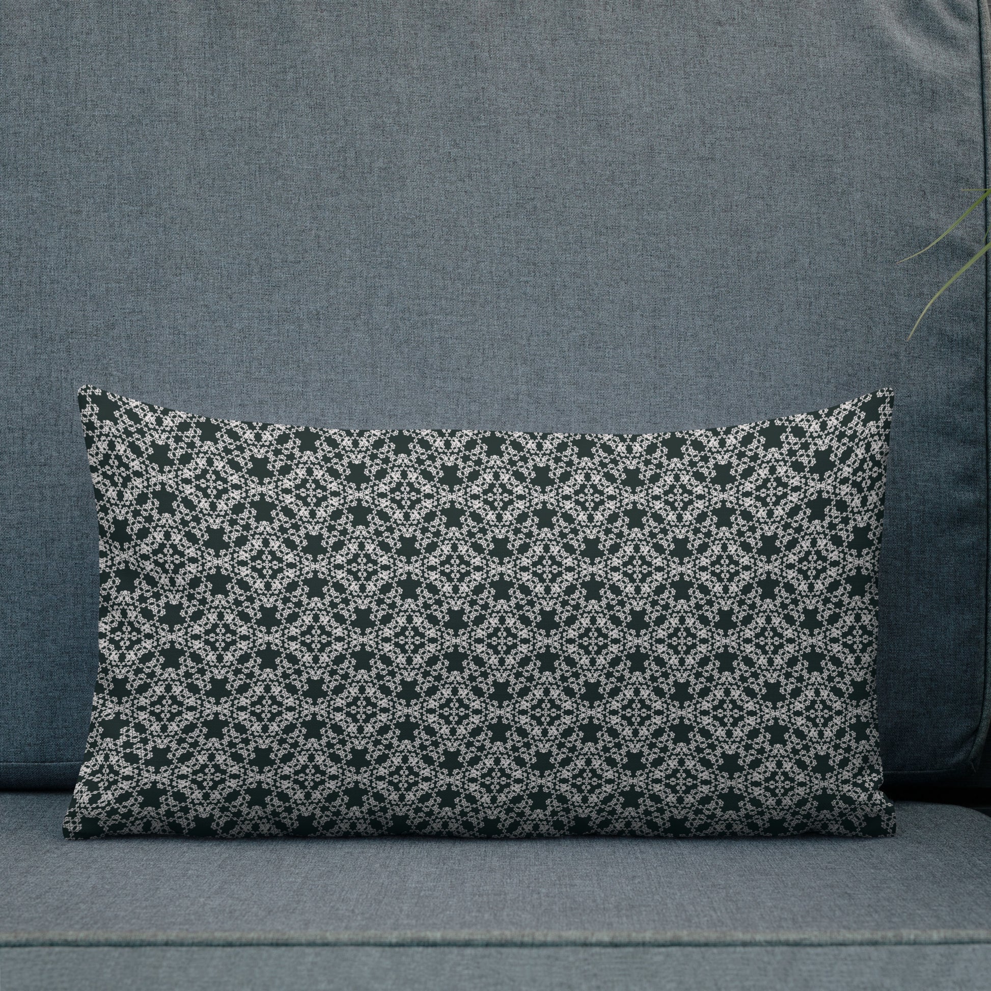 20″×12″ premium throw pillow with the 'Tetragon' charcoal and white geometric pattern shown in a lifestyle setting.