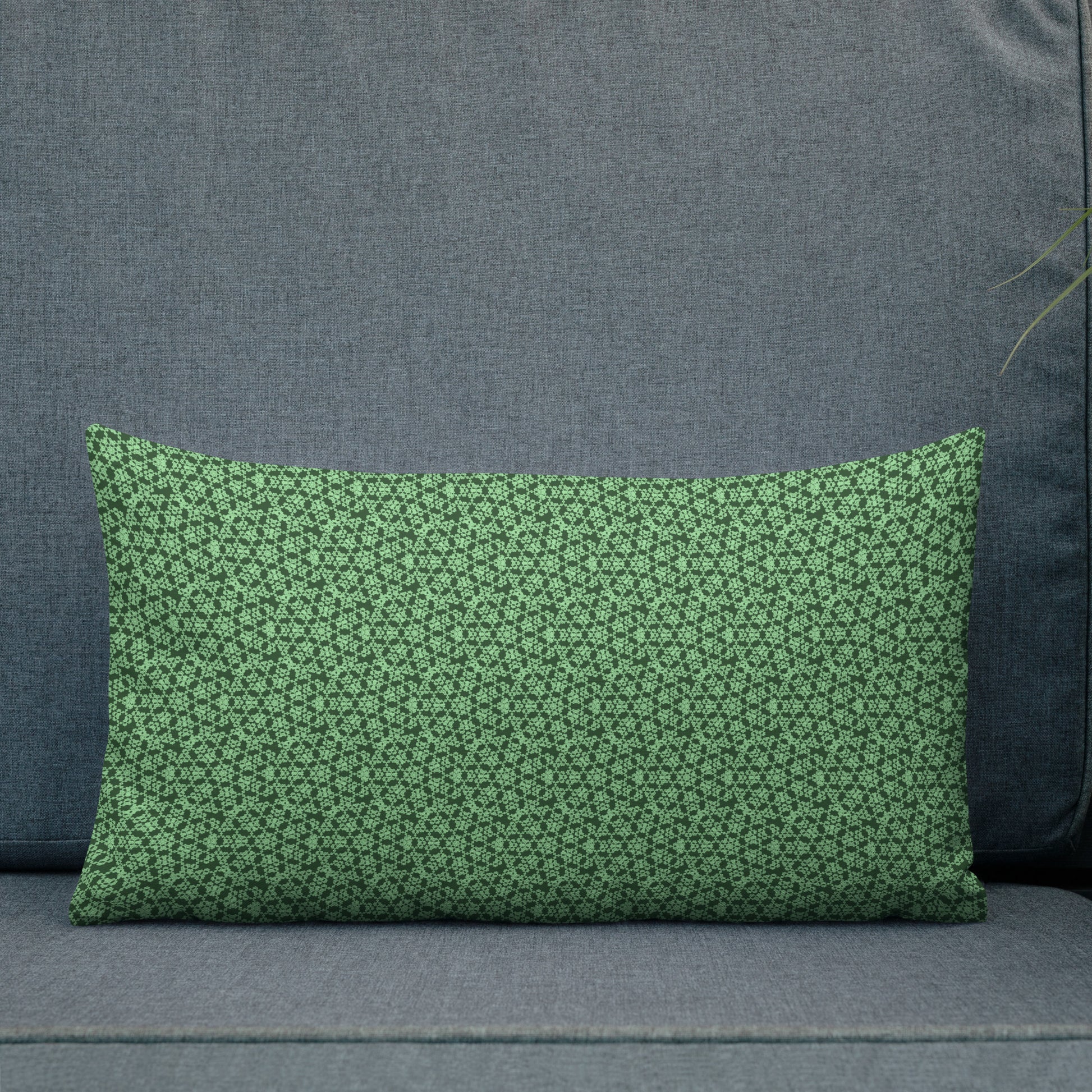 20″×12″ premium throw pillow with the 'Heptagon' green geometric pattern shown in a lifestyle setting.