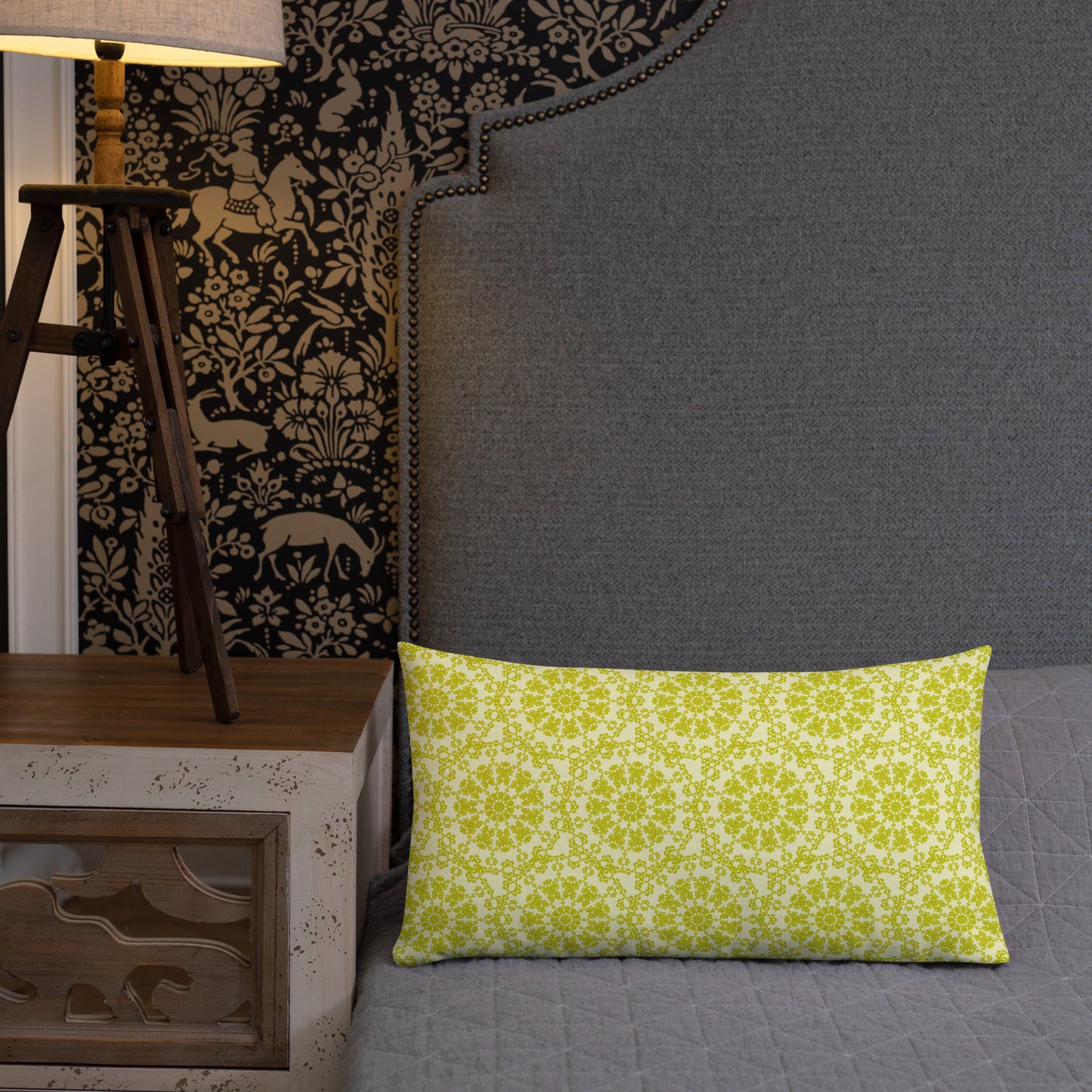 20″×12″ premium throw pillow with the 'Hendecagon' yellow-green geometric pattern on a bed with ornate dark headboard