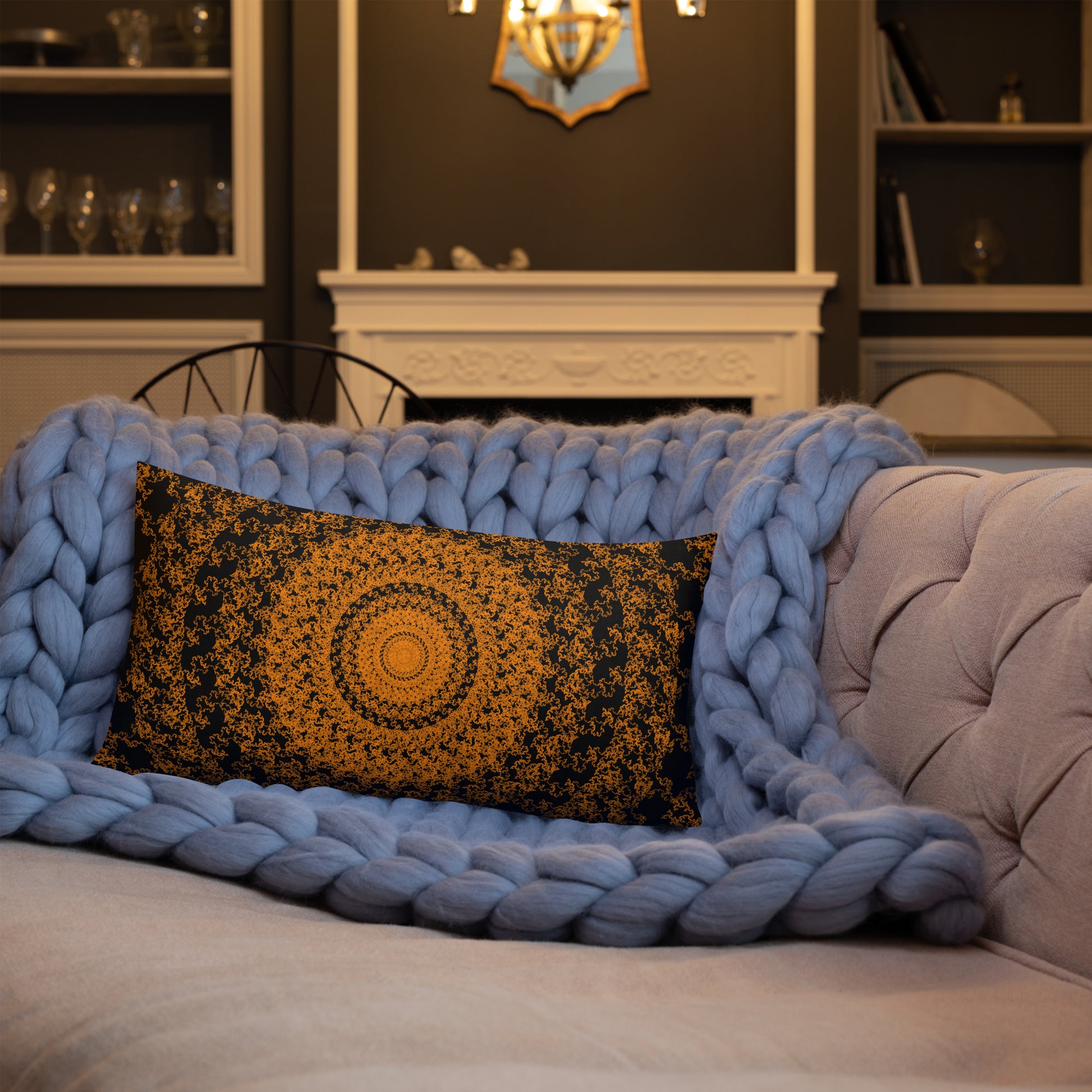 20″×12″ premium throw pillow with the 'The Sun' orange and black geometric design shown in a lifestyle setting.