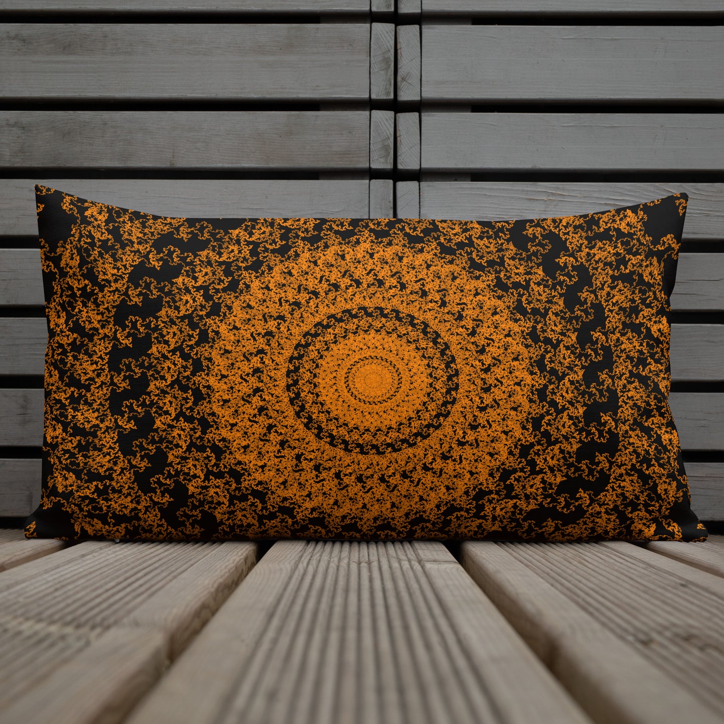20″×12″ premium throw pillow with the 'The Sun' orange and black geometric design shown in a lifestyle setting.