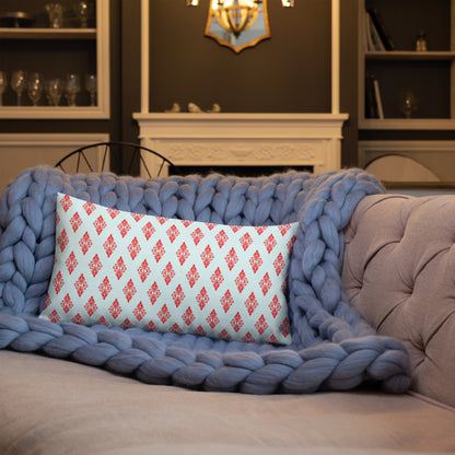 20″×12″ premium throw pillow with the 'Digon' sky blue and red geometric pattern shown in a lifestyle setting.