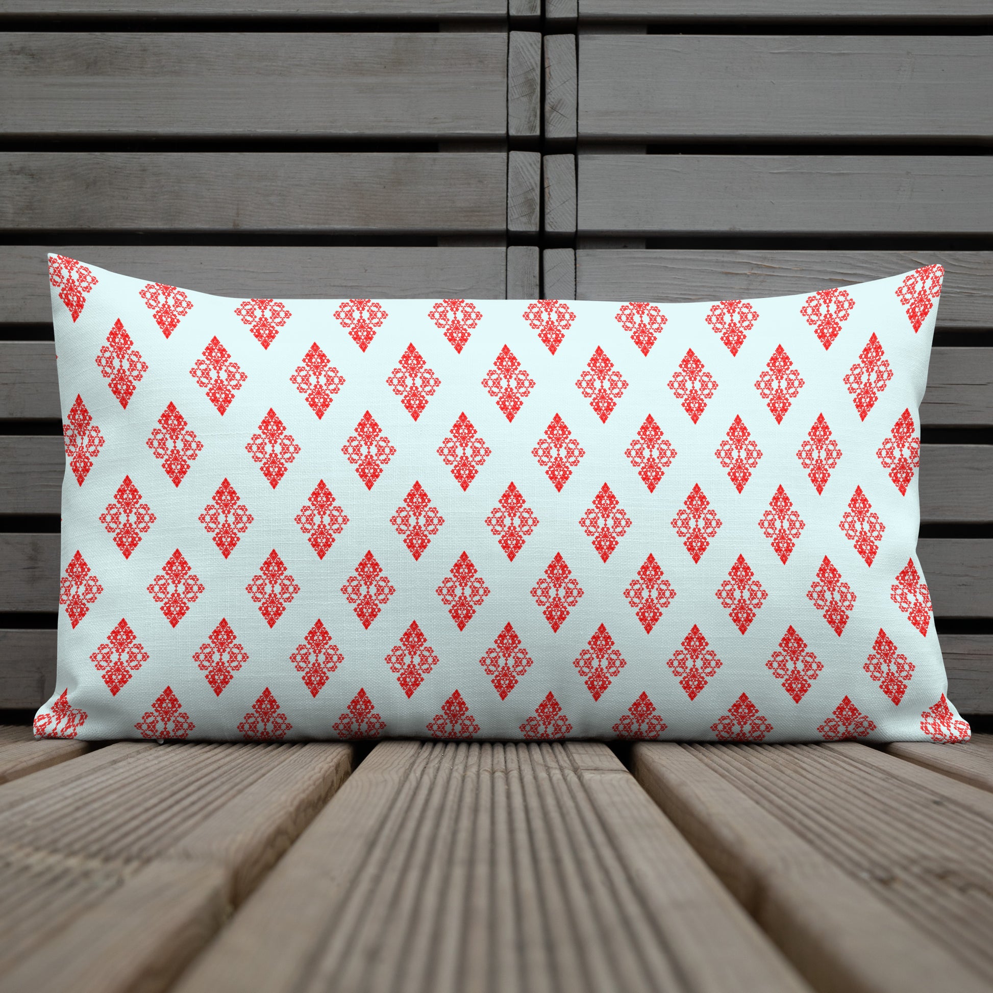 20″×12″ premium throw pillow with the 'Digon' sky blue and red geometric pattern shown in a lifestyle setting.