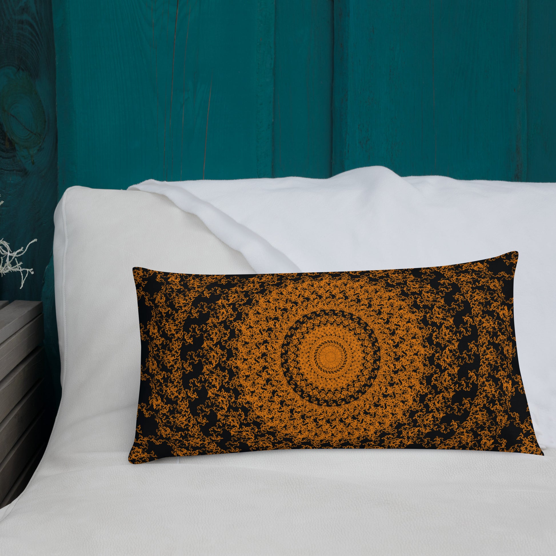 20″×12″ premium throw pillow with the 'The Sun' orange and black geometric design shown in a lifestyle setting.