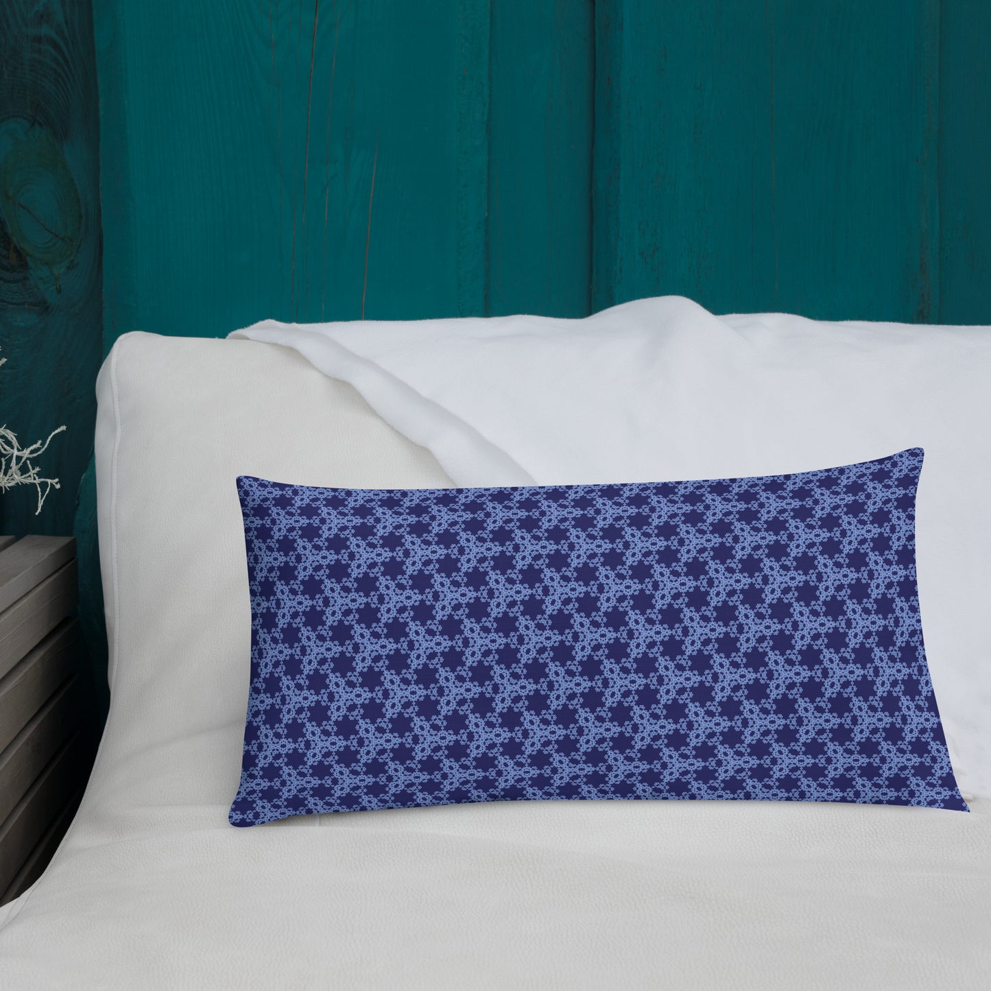 20″×12″ premium throw pillow with the 'Triagon' navy and blue geometric pattern shown in a lifestyle setting.