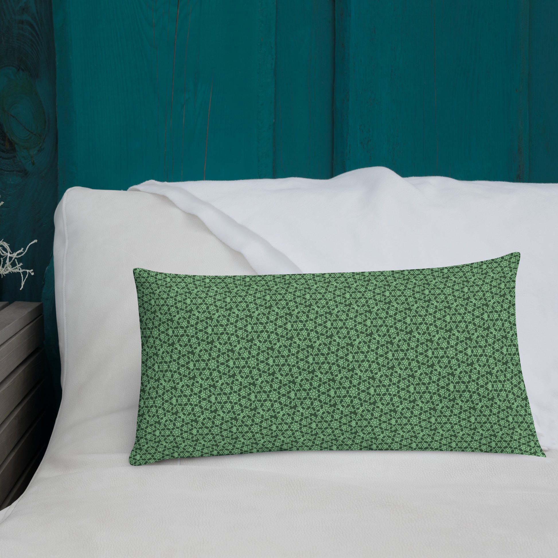 20″×12″ premium throw pillow with the 'Heptagon' green geometric pattern shown in a lifestyle setting.