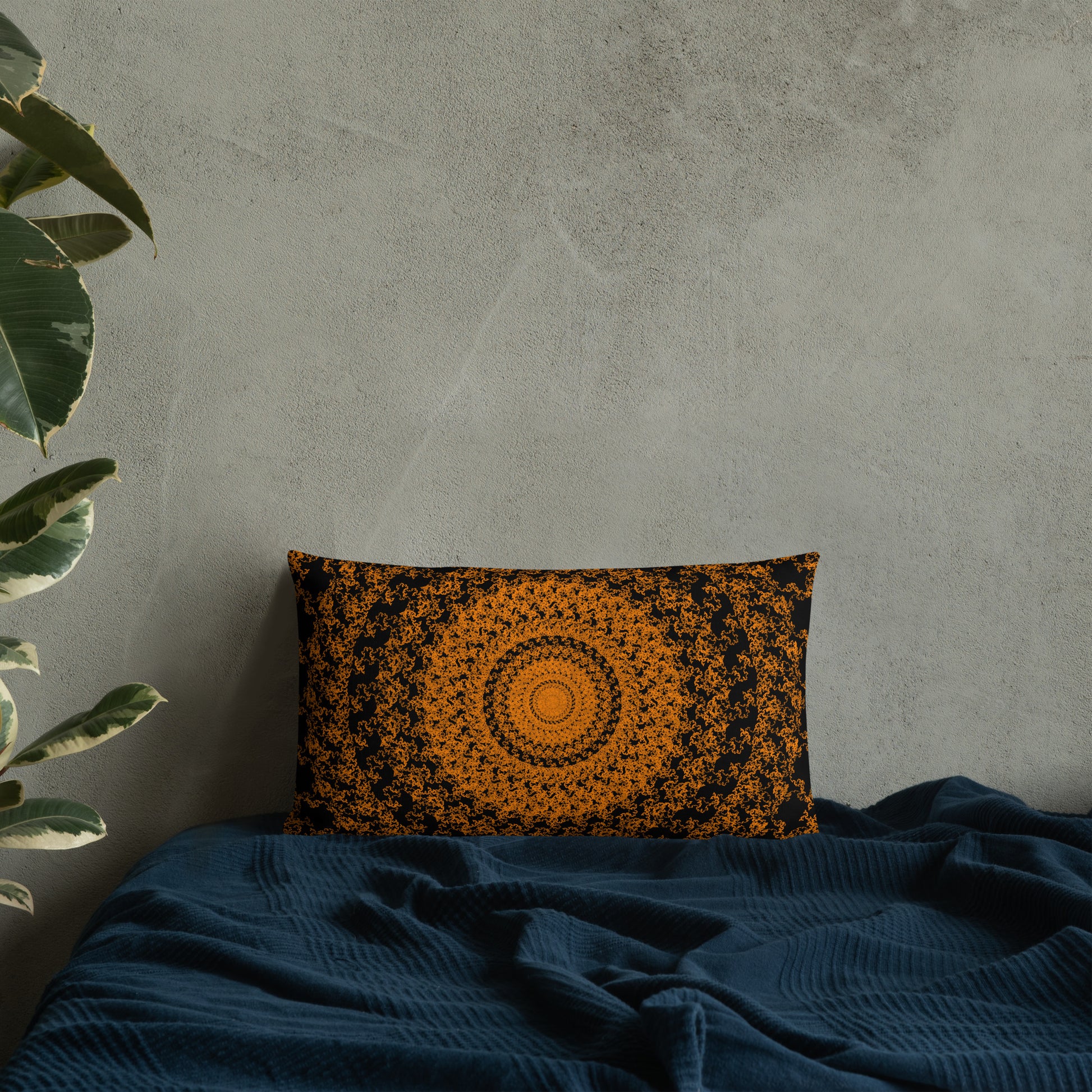 20″×12″ premium throw pillow with the 'The Sun' orange and black geometric design on a bed.
