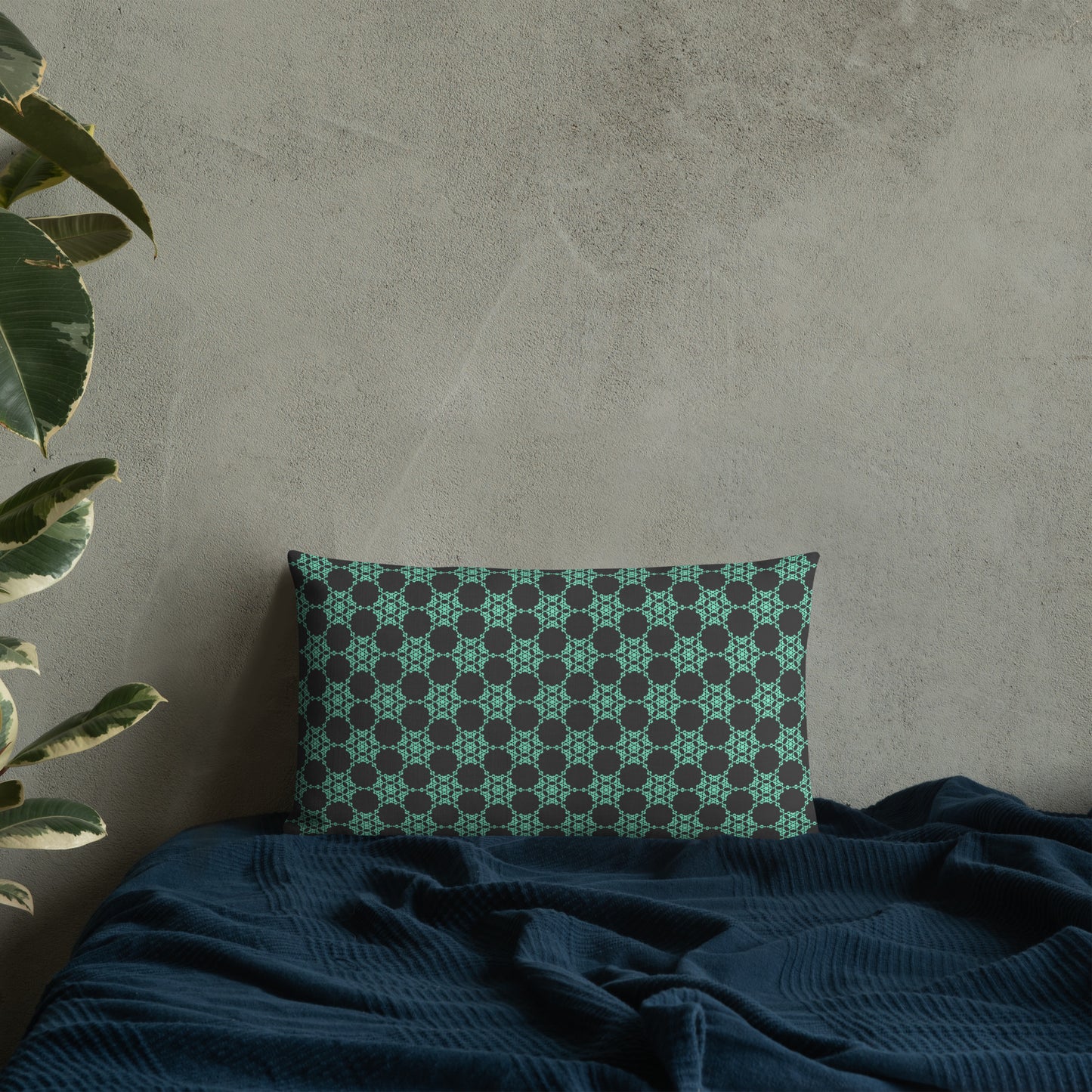 20″×12″ premium throw pillow with the 'Flowers Victory' charcoal and mint geometric pattern on a bed.