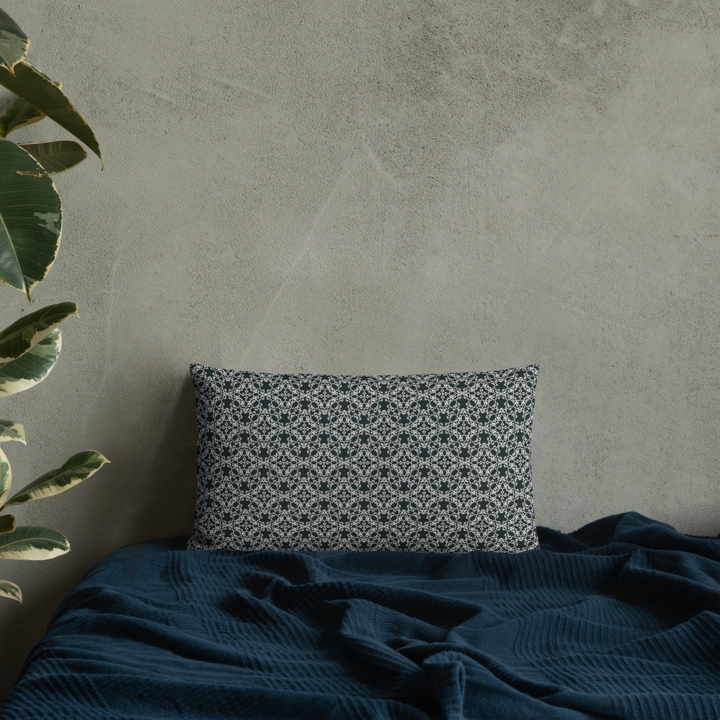 20″×12″ premium throw pillow with the 'Tetragon' charcoal and white geometric pattern on a bed.