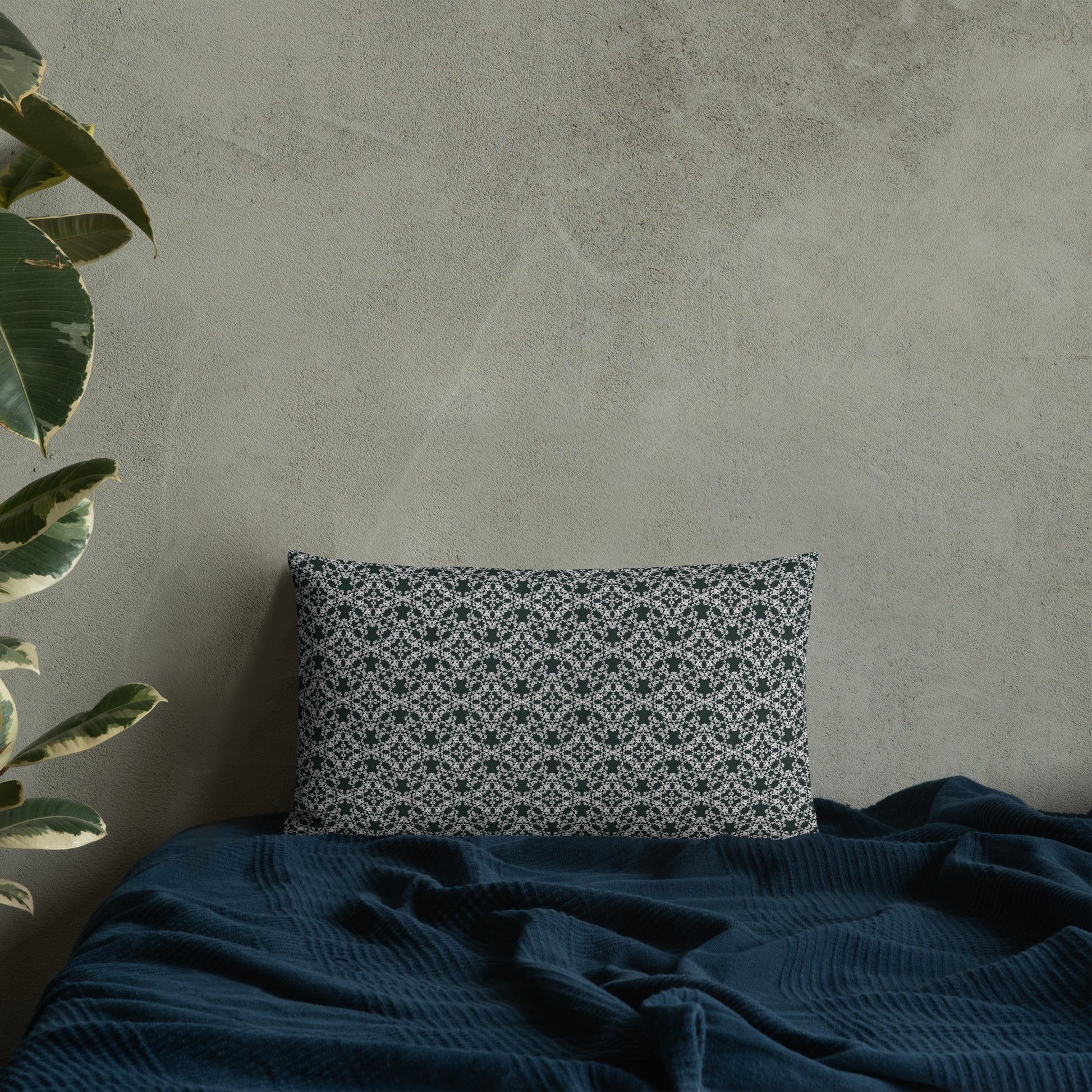 20″×12″ premium throw pillow with the 'Tetragon' charcoal and white geometric pattern on a bed.