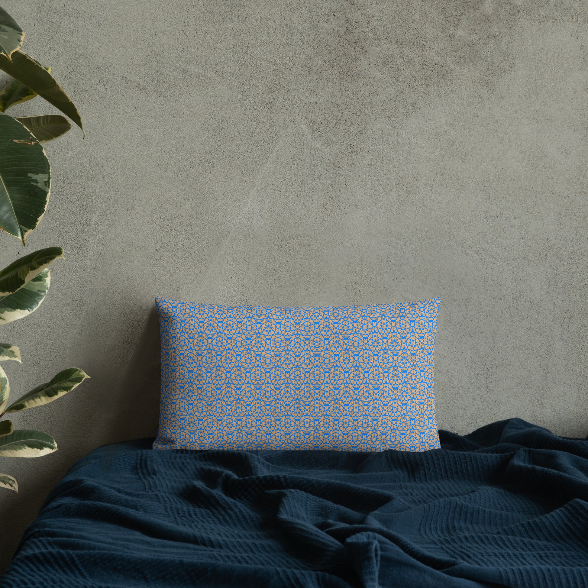20″×12″ premium throw pillow with the 'Pentagon' blue and yellow geometric pattern on a bed.