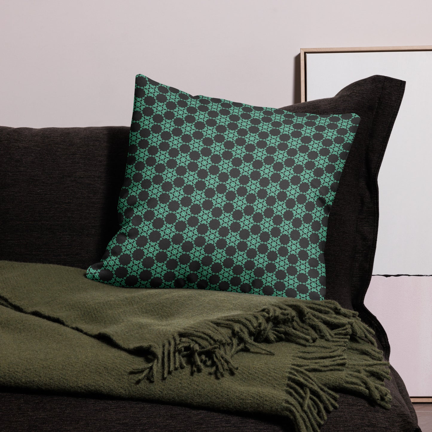 22″×22″ premium throw pillow with the 'Flowers Victory' charcoal and mint geometric pattern on a couch.