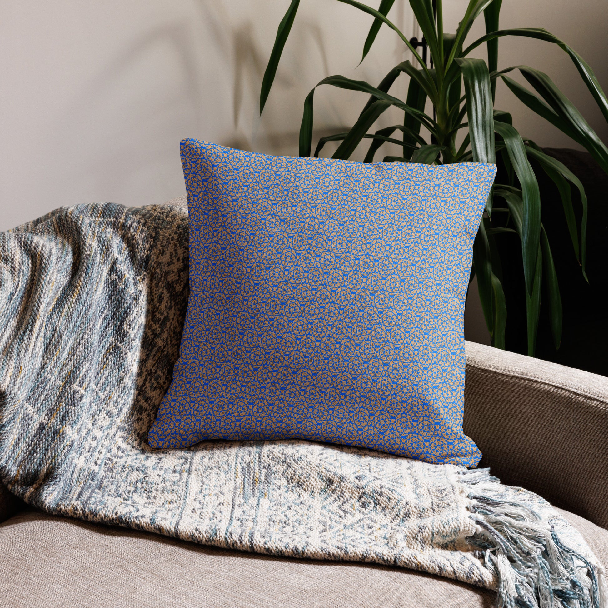 22″×22″ premium throw pillow with the 'Pentagon' blue and yellow geometric pattern on a couch.