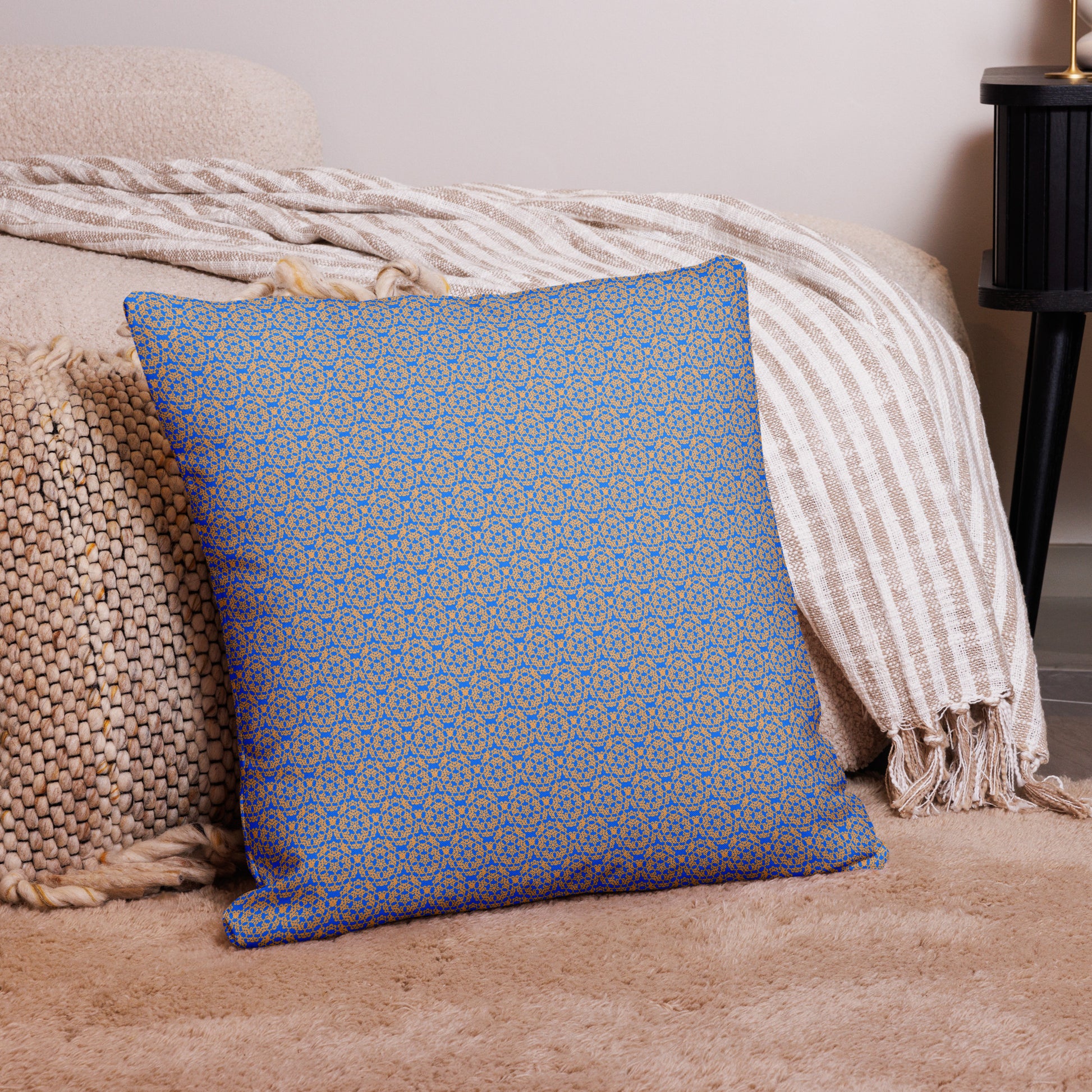 22″×22″ premium throw pillow with the 'Pentagon' blue and yellow geometric pattern on a couch.
