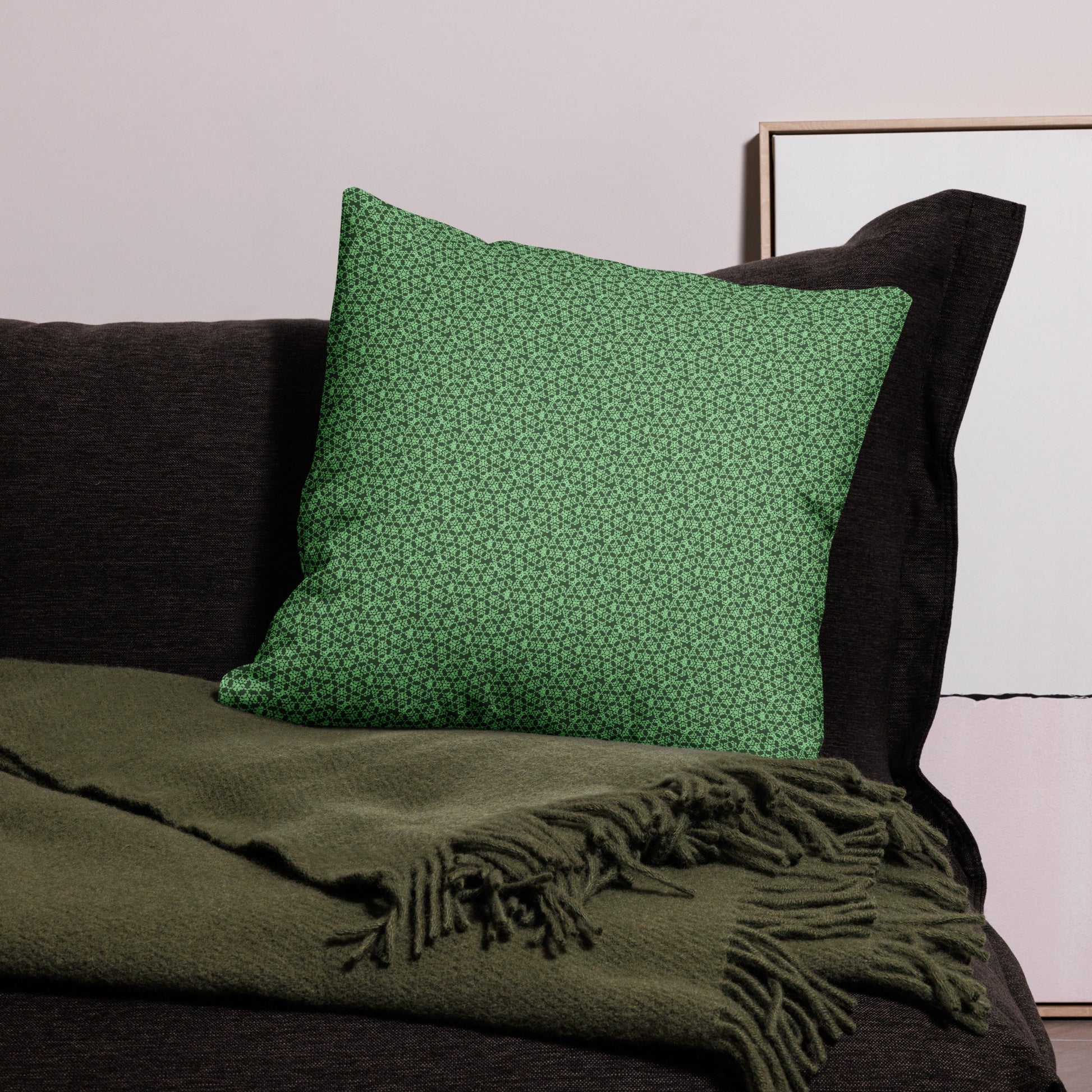 22″×22″ premium throw pillow with the 'Heptagon' green geometric pattern on a couch.
