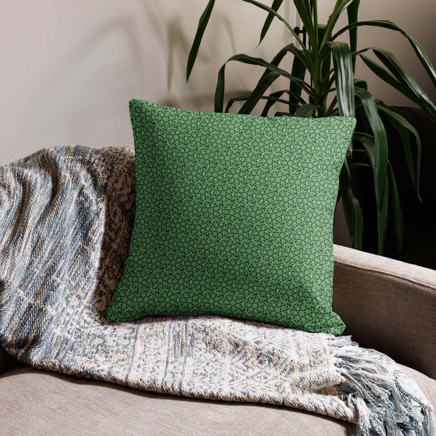 22″×22″ premium throw pillow with the 'Heptagon' green geometric pattern on a couch.
