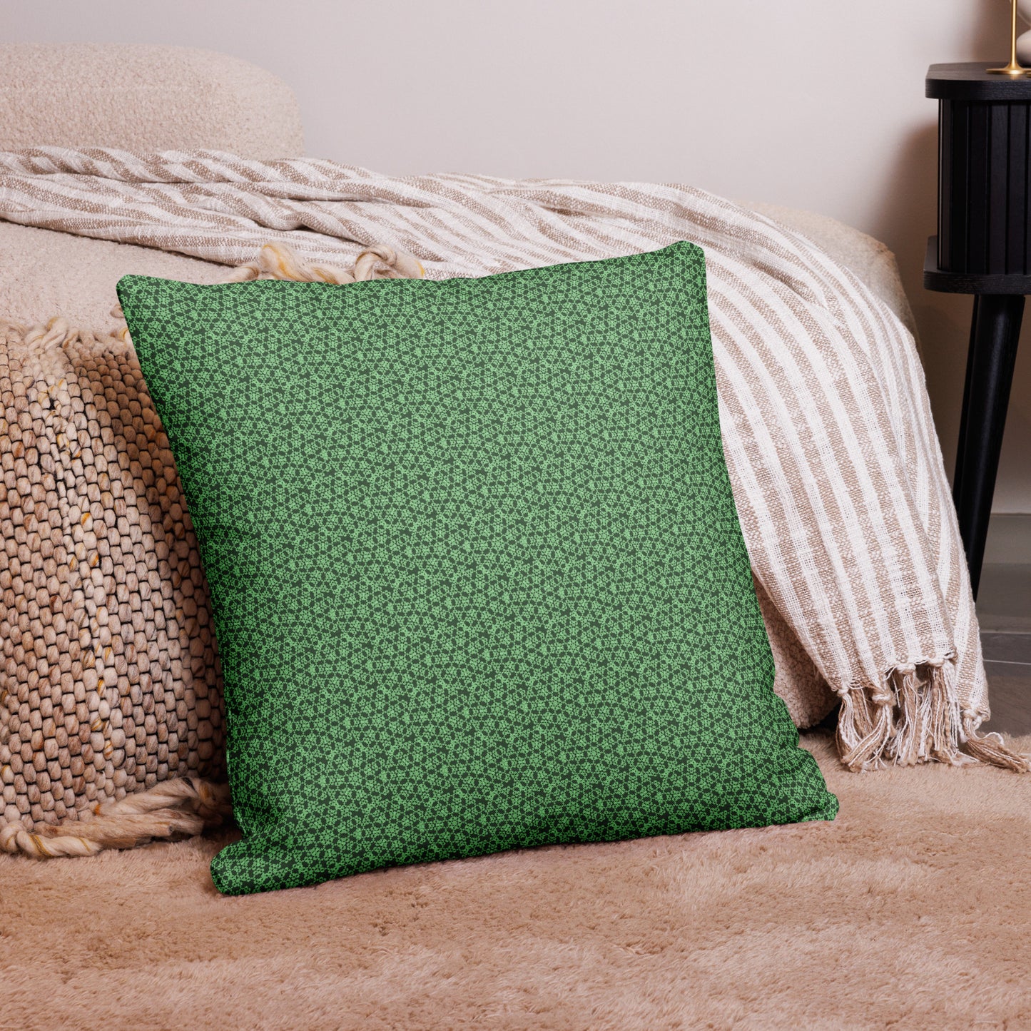 22″×22″ premium throw pillow with the 'Heptagon' green geometric pattern on a couch.