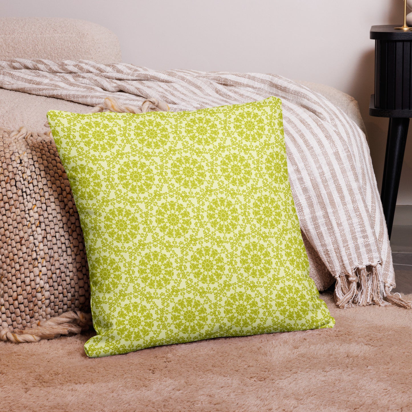 22″×22″ premium throw pillow with the 'Hendecagon' yellow-green geometric pattern in a cozy floor setting