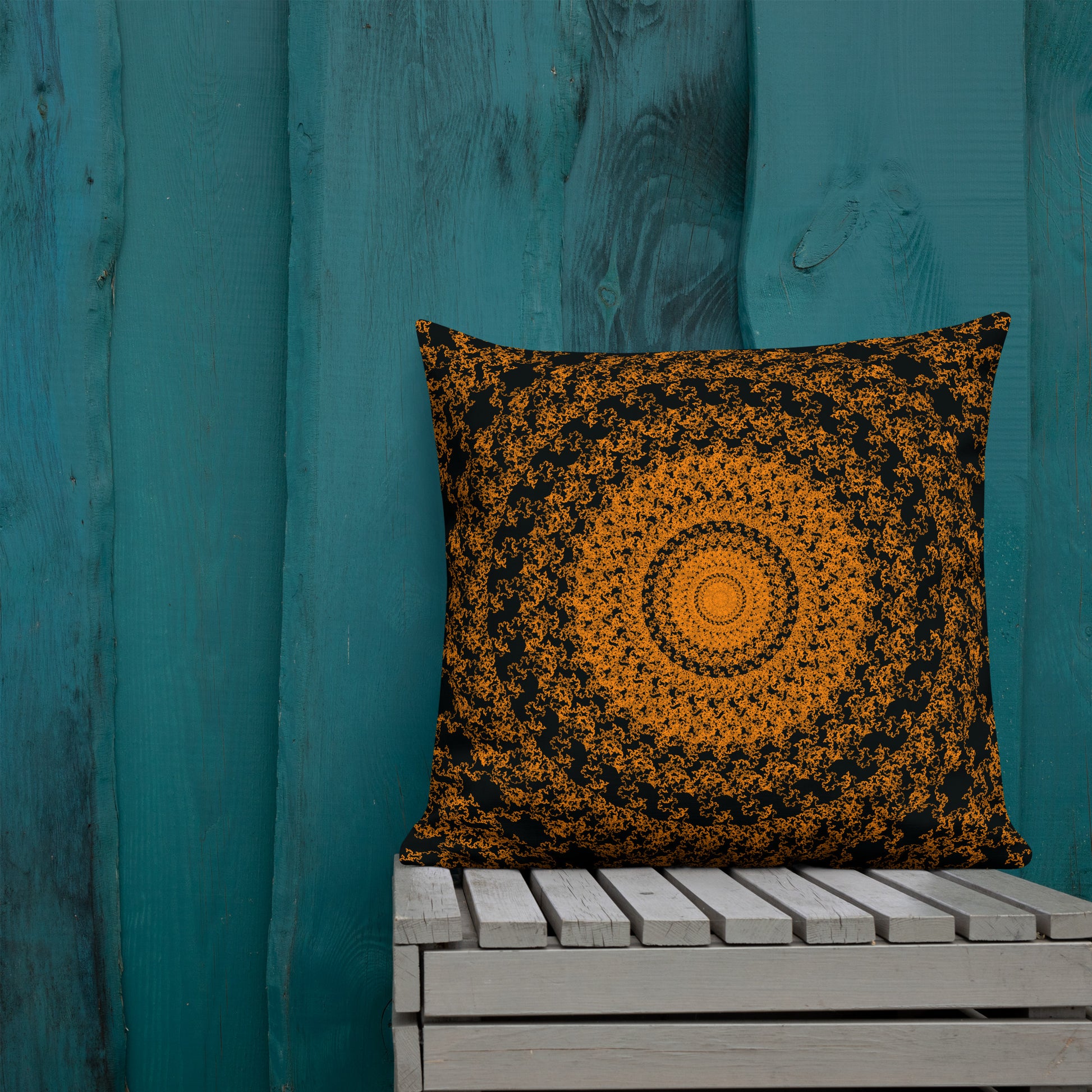 22″×22″ premium throw pillow with the 'The Sun' orange and black geometric design shown in a lifestyle setting.