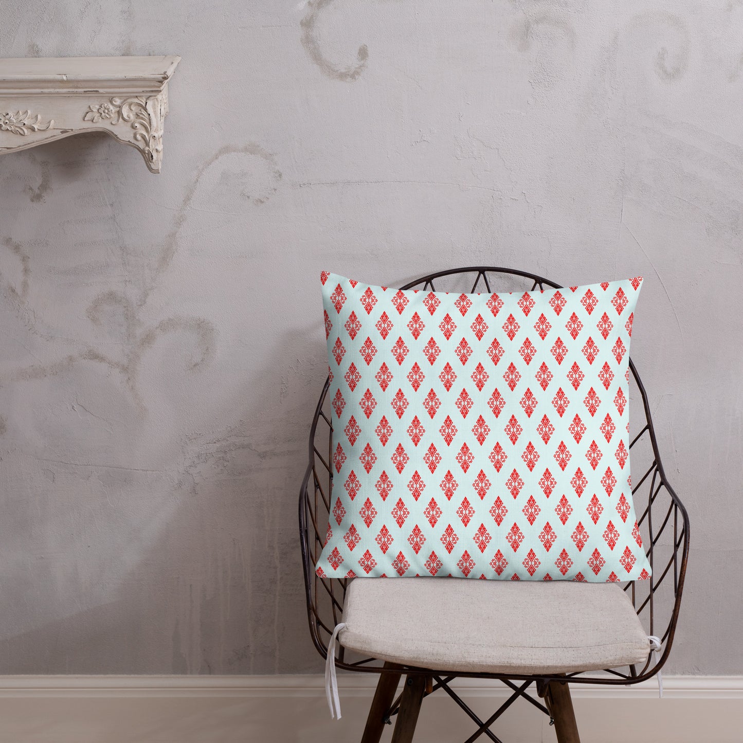 22″×22″ premium throw pillow with the 'Digon' sky blue and red geometric pattern shown in a lifestyle setting.
