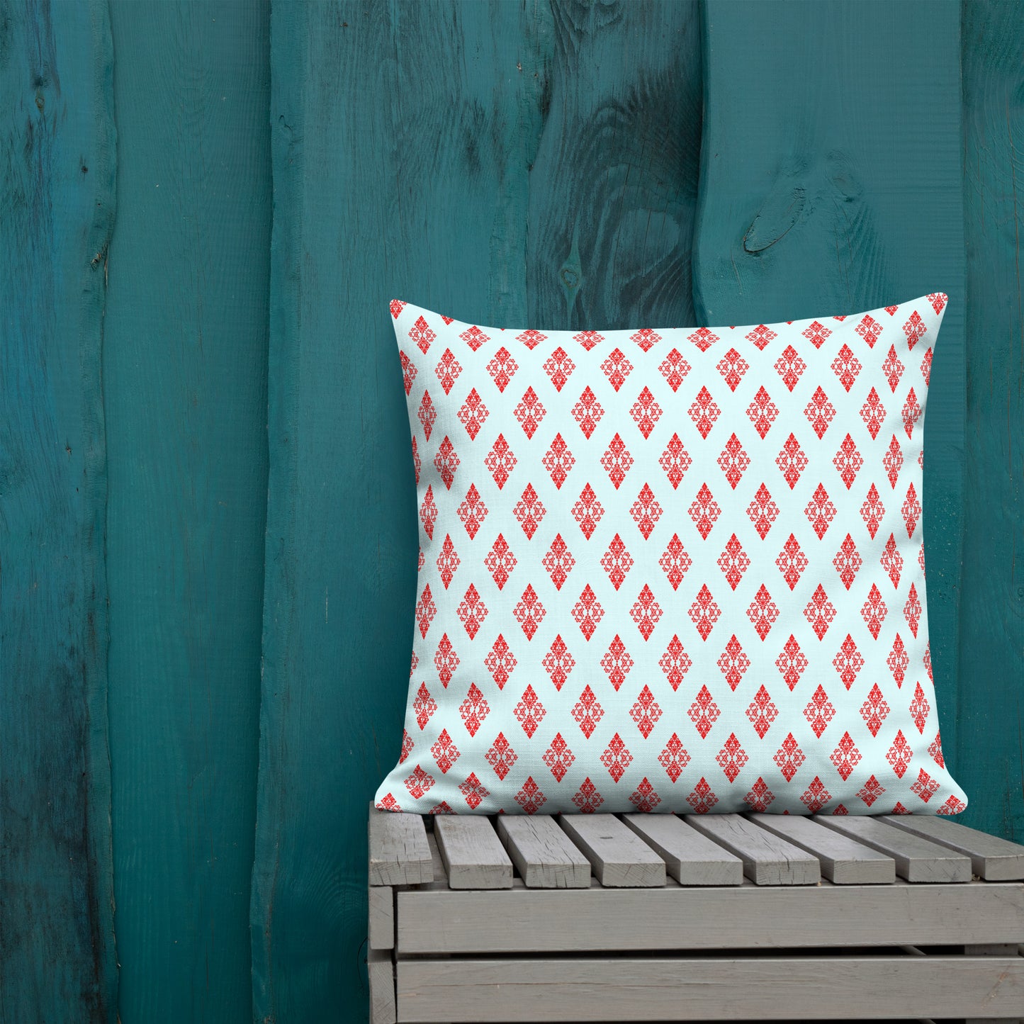22″×22″ premium throw pillow with the 'Digon' sky blue and red geometric pattern shown in a lifestyle setting.