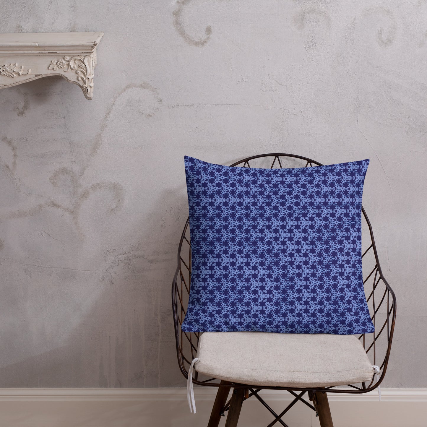 22″×22″ premium throw pillow with the 'Trigon' navy and blue geometric pattern shown in a lifestyle setting.
