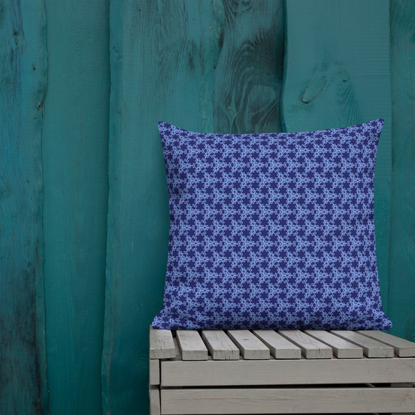 22″×22″ premium throw pillow with the 'Trigon' navy and blue geometric pattern shown in a lifestyle setting.
