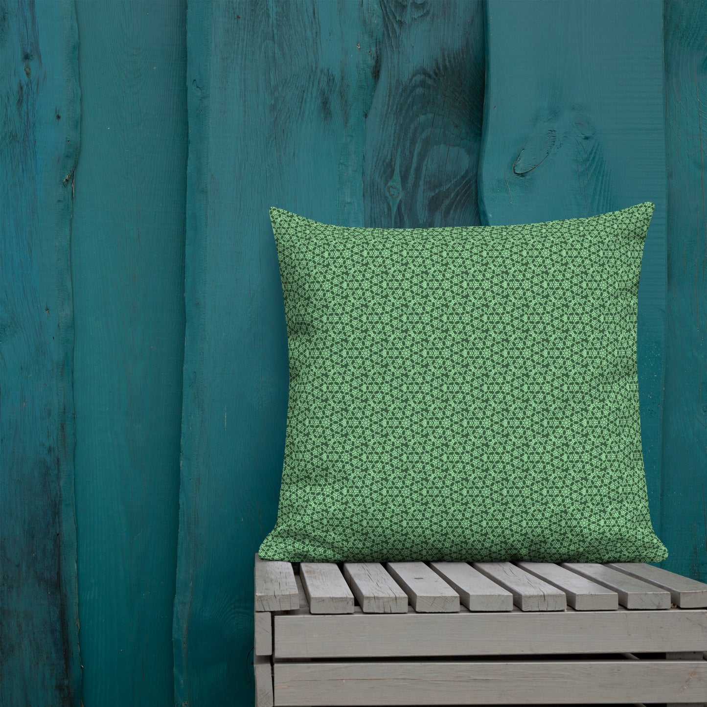 22″×22″ premium throw pillow with the 'Heptagon' green geometric pattern shown in a lifestyle setting.