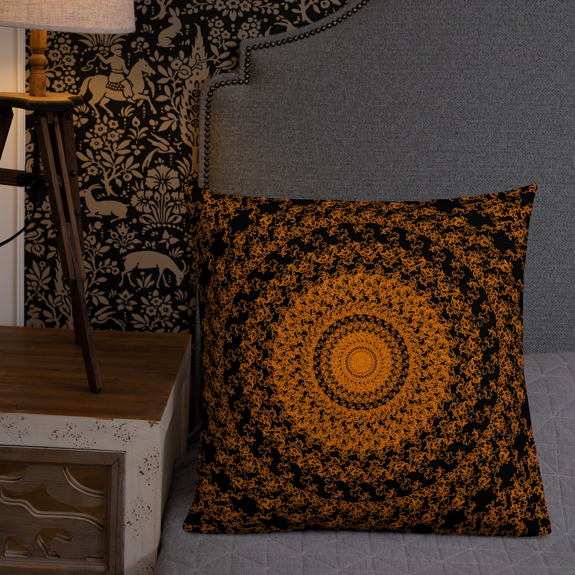 22″×22″ premium throw pillow with the 'The Sun' orange and black geometric design shown in a lifestyle setting.
