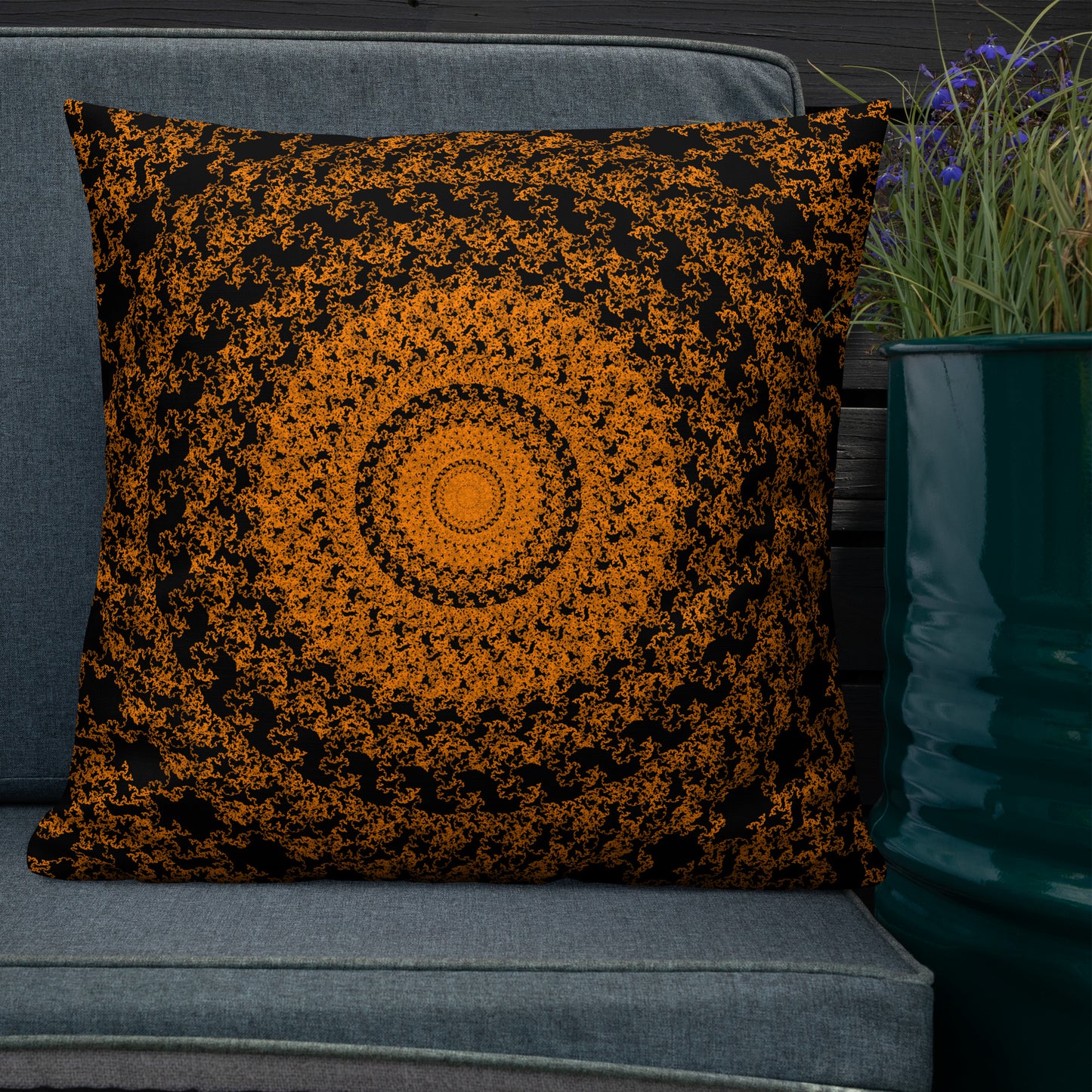 22″×22″ premium throw pillow with the 'The Sun' orange and black geometric design shown in a lifestyle setting.