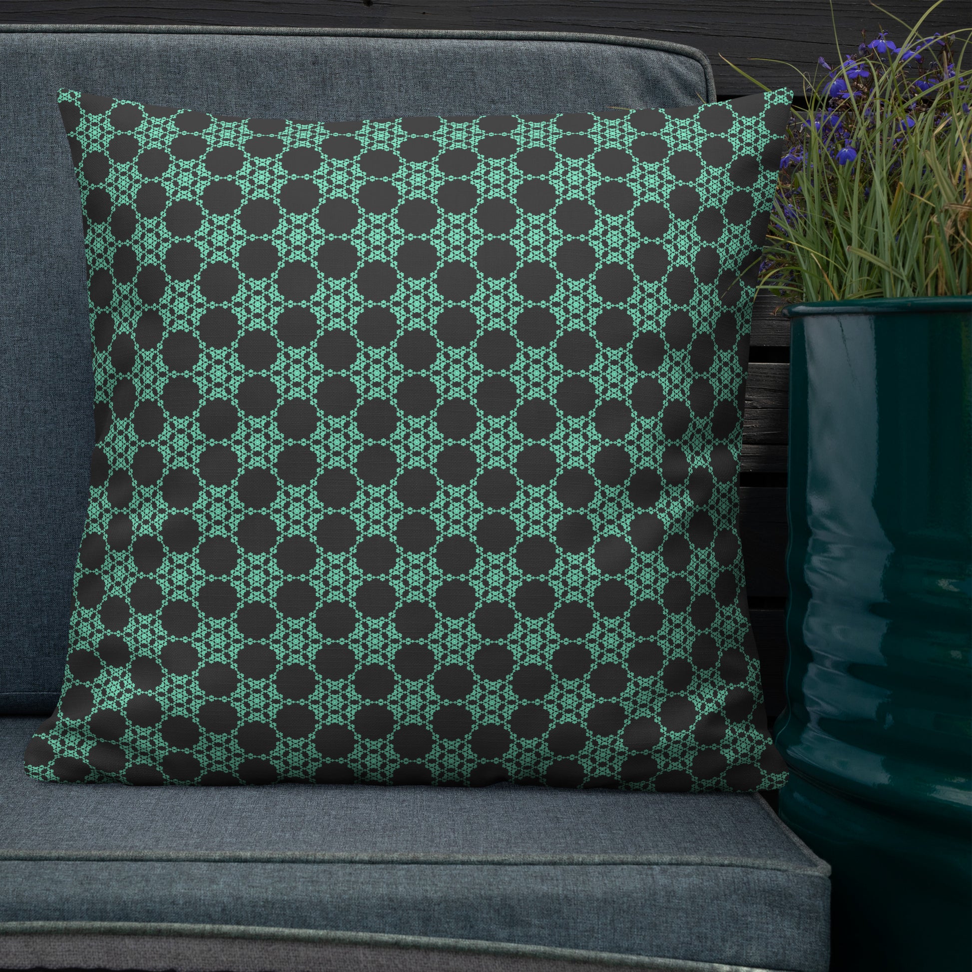 22″×22″ premium throw pillow with the 'Flowers Victory' charcoal and mint geometric pattern shown in a lifestyle setting.