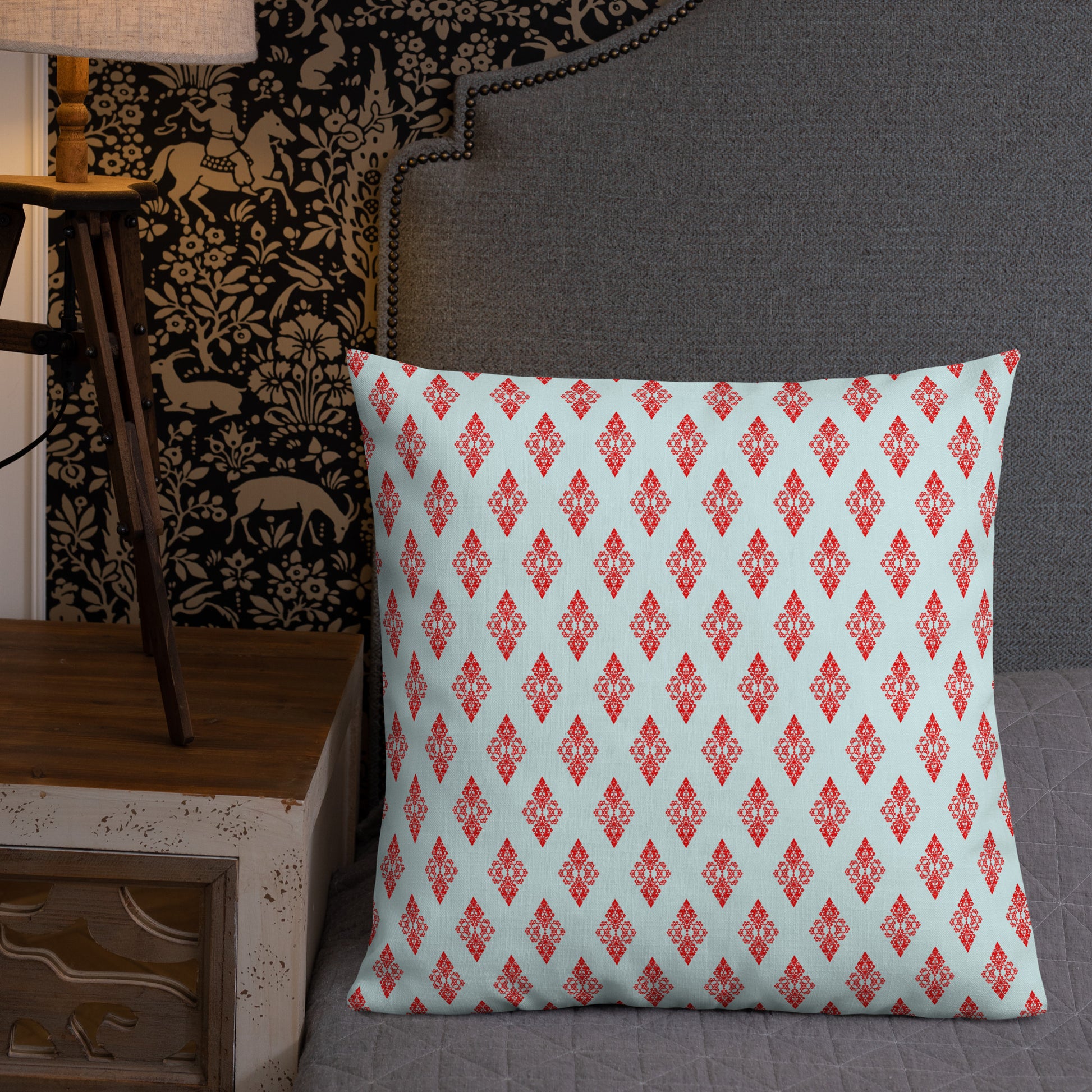 22″×22″ premium throw pillow with the 'Digon' sky blue and red geometric pattern shown in a lifestyle setting.