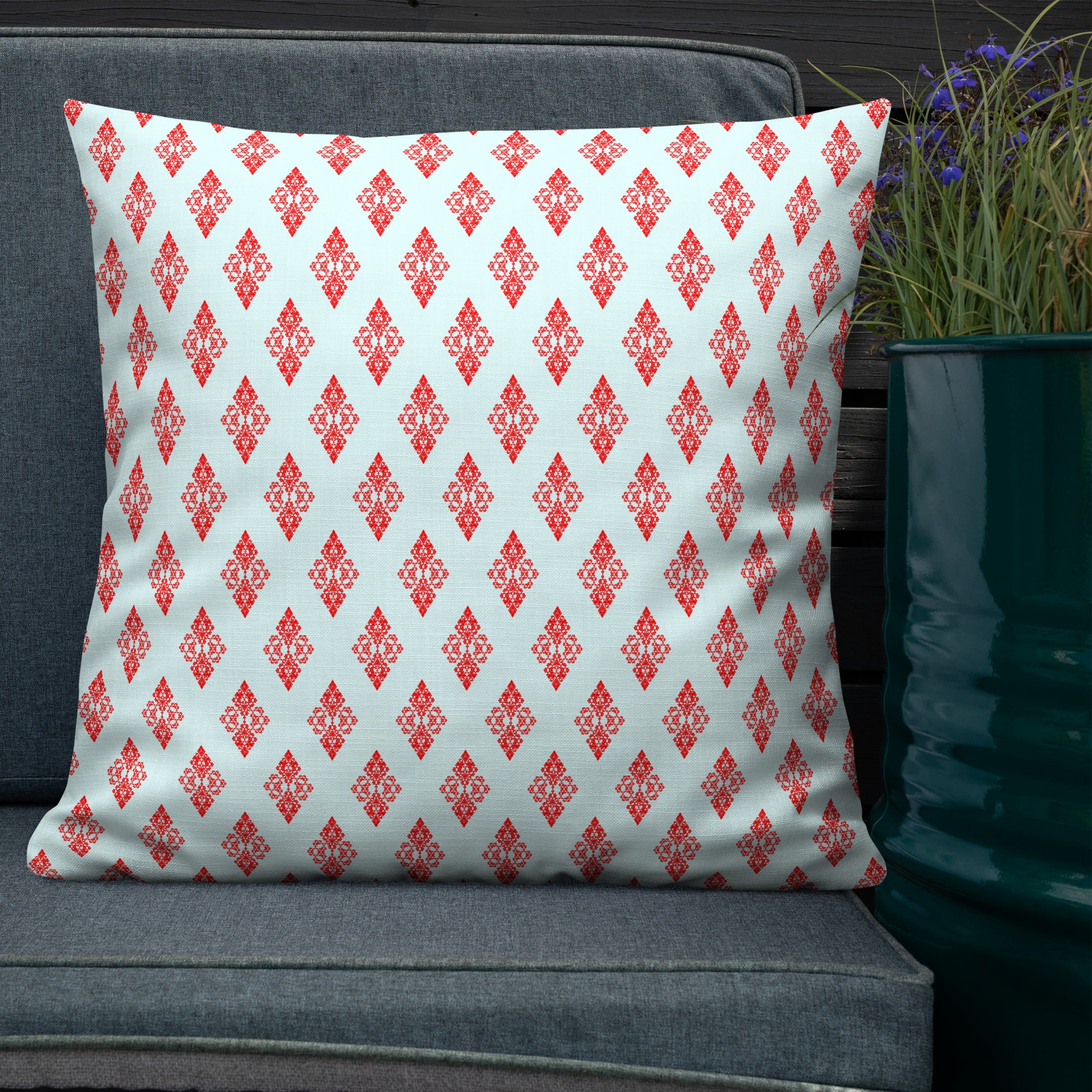 22″×22″ premium throw pillow with the 'Digon' sky blue and red geometric pattern shown in a lifestyle setting.