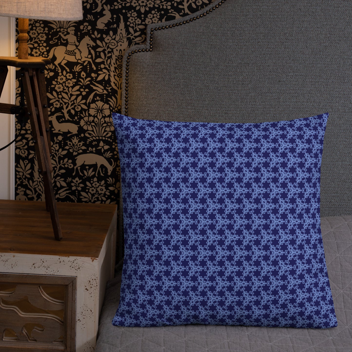 22″×22″ premium throw pillow with the 'Trigon' navy and blue geometric pattern shown in a lifestyle setting.