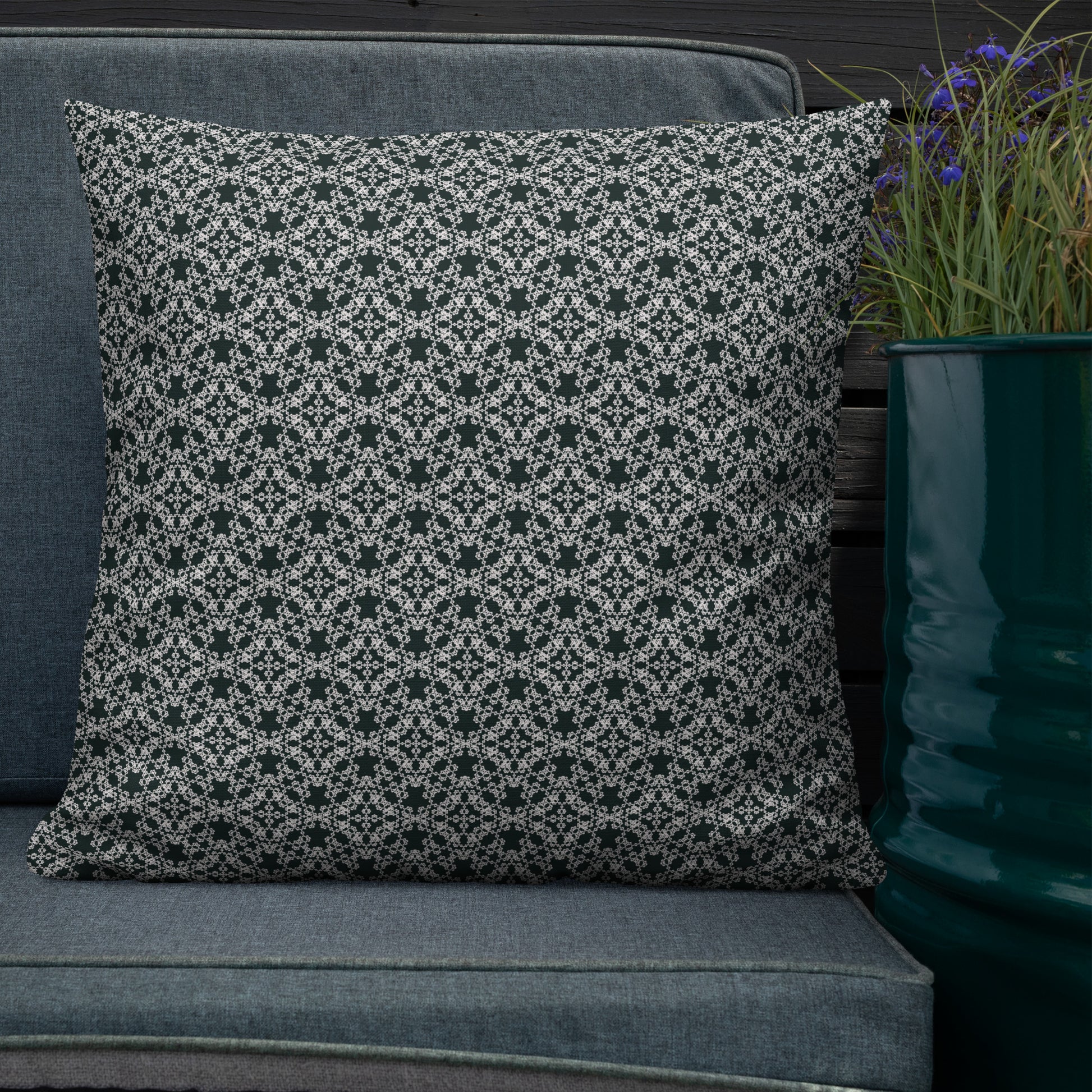 22″×22″ premium throw pillow with the 'Tetragon' charcoal and white geometric pattern shown in a lifestyle setting.