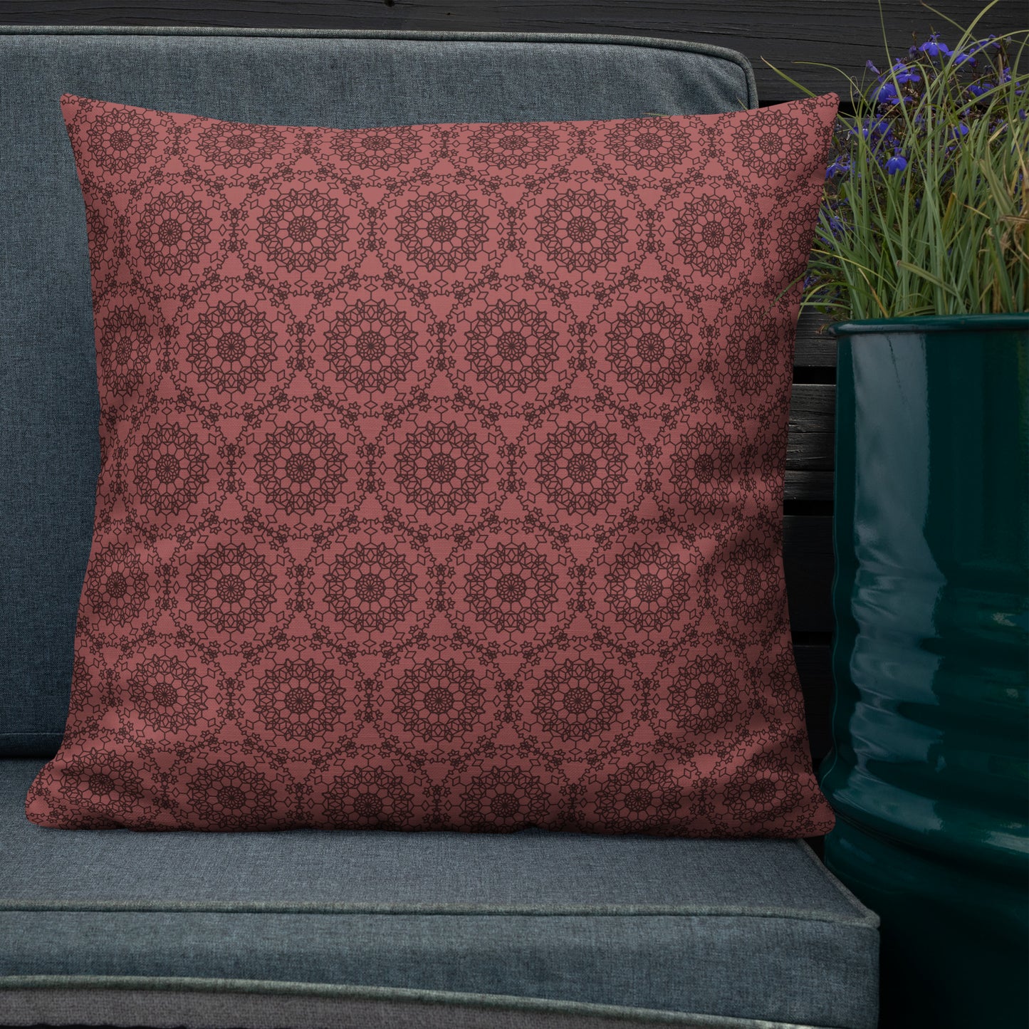 22″×22″ premium throw pillow with the 'Dodecagon' rose geometric pattern on grey outdoor sofa.