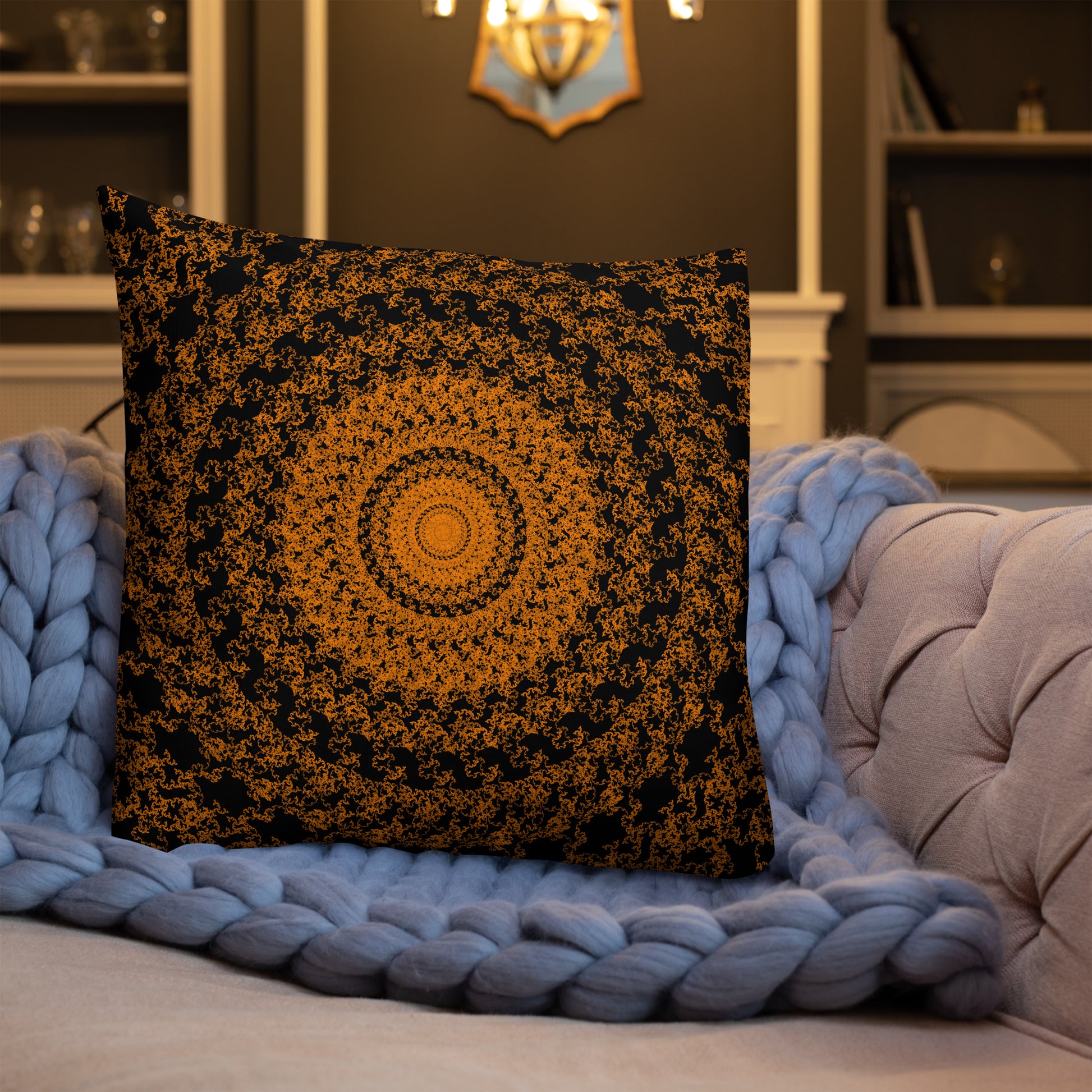 22″×22″ premium throw pillow with the 'The Sun' orange and black geometric design shown in a lifestyle setting.